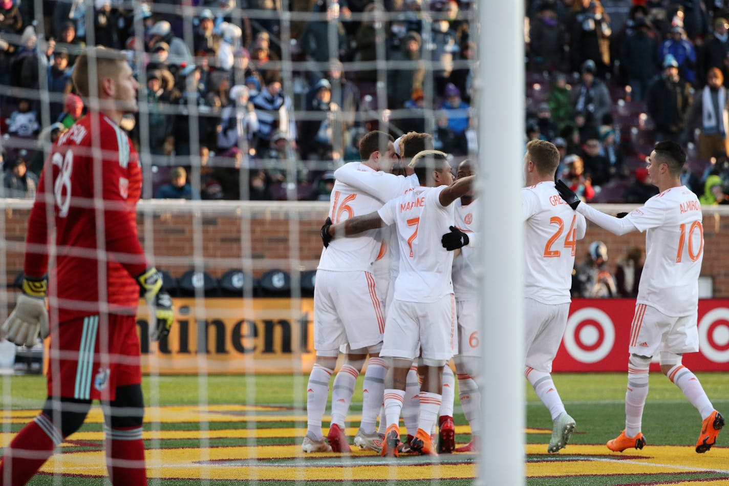 Atlanta United players celebrate after Minnesota United defender Francisco Calvo (5) scored an own goal past goalkeeper Matt Lampson (28) in the first half at TCF Bank Stadium in Minneapolis on Saturday, March 31, 2018. (Anthony Souffle/Minneapolis Star Tribune/TNS)