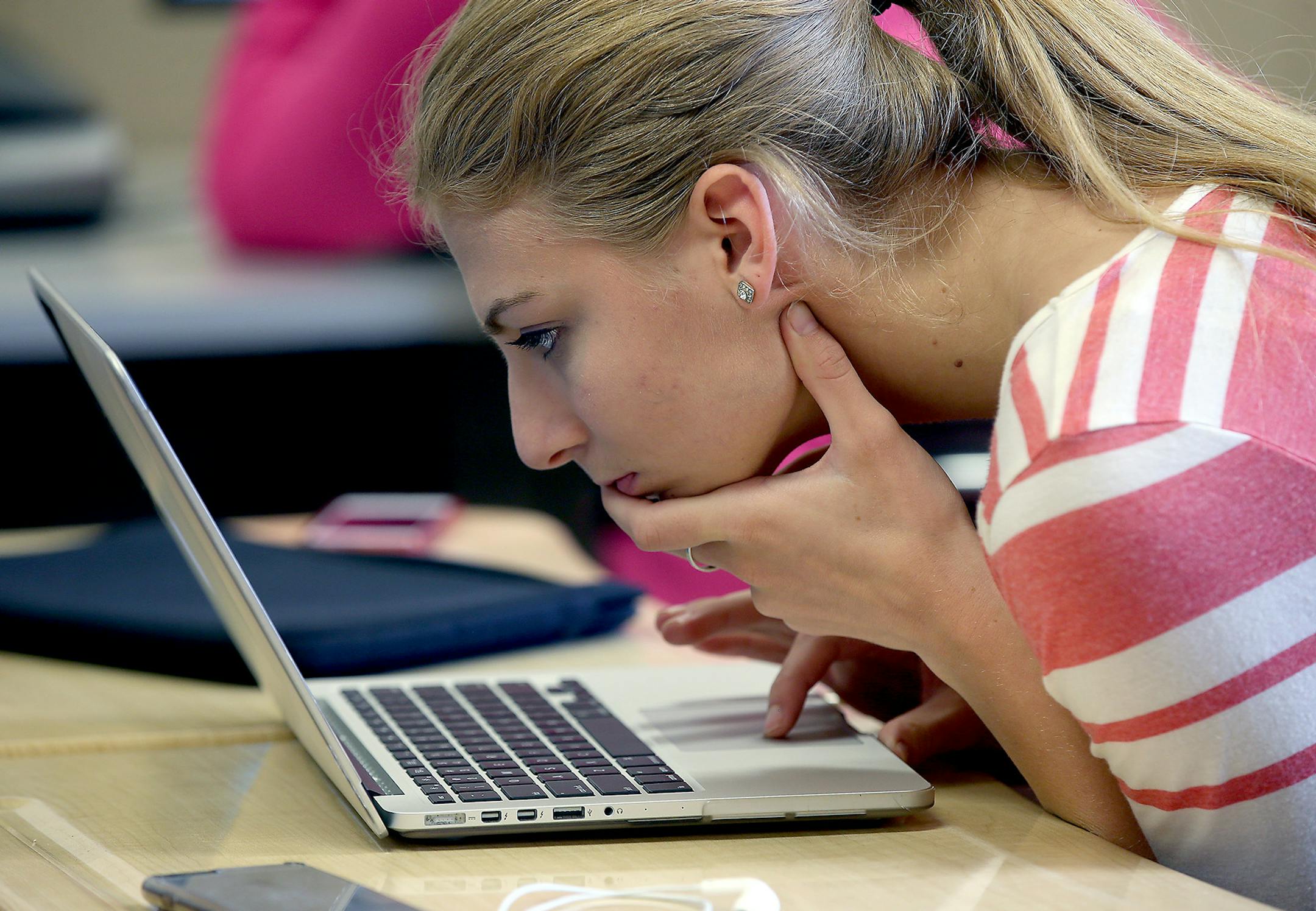 Stillwater High School Alex Magler put the pages of the yearbook together, Friday, April 10, 2015 in Stillwater, MN. ] (ELIZABETH FLORES/STAR TRIBUNE) ELIZABETH FLORES • eflores@startribune.com