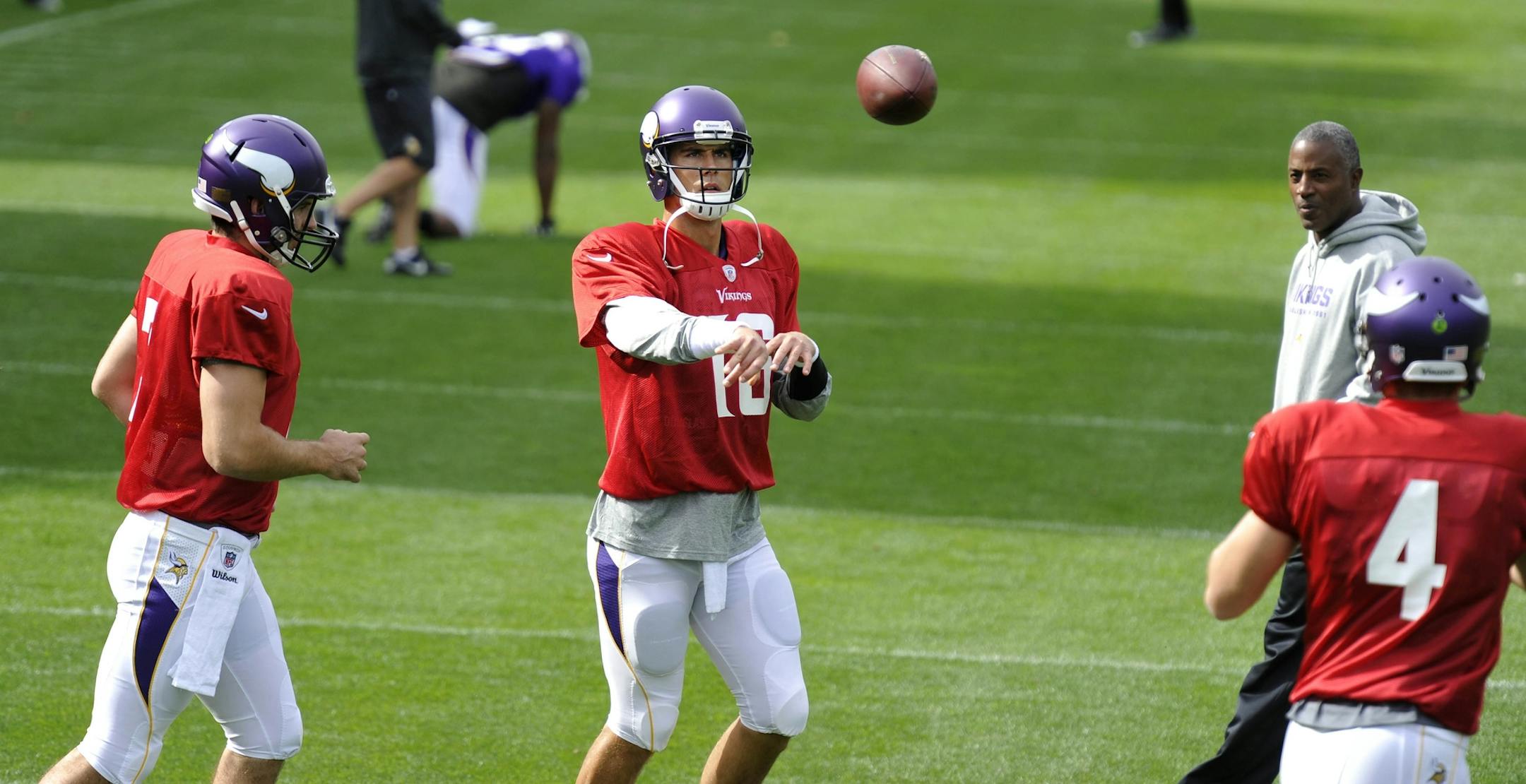 Viking quarterbacks Matt Cassel, left, Christian Ponder, center, and McLeod Bethel-Thompson during practice at the Grove Hotel in Watford, England, Thursday Sept. 26, 2013. (AP Photo/Sean Ryan, NFL)
