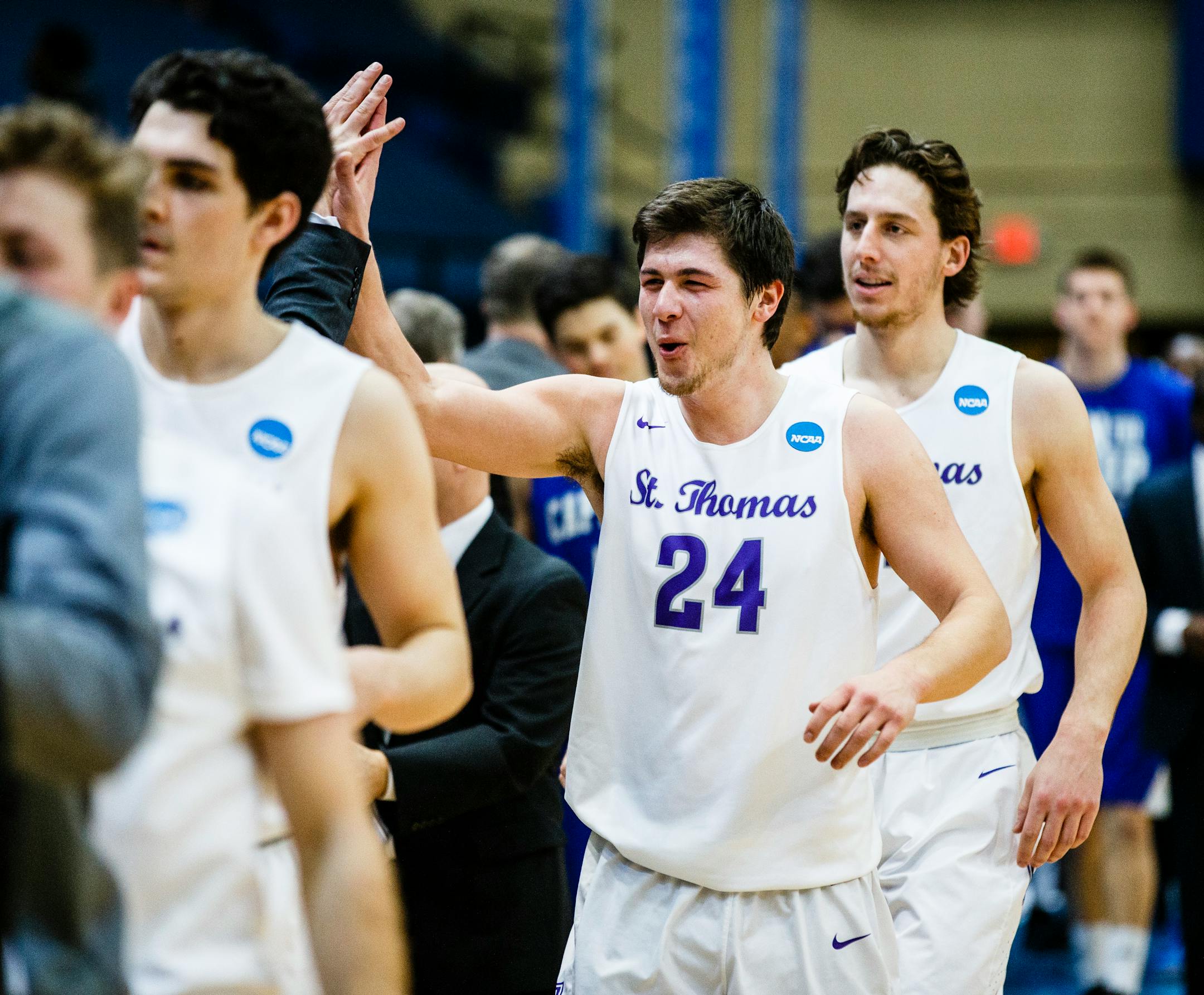 Taylor Montero celebrates a St. Thomas victory following the NCAA Division III men's basketball semi-final game March 18, 2016 at the Salem Civic Center in Salem, Va.