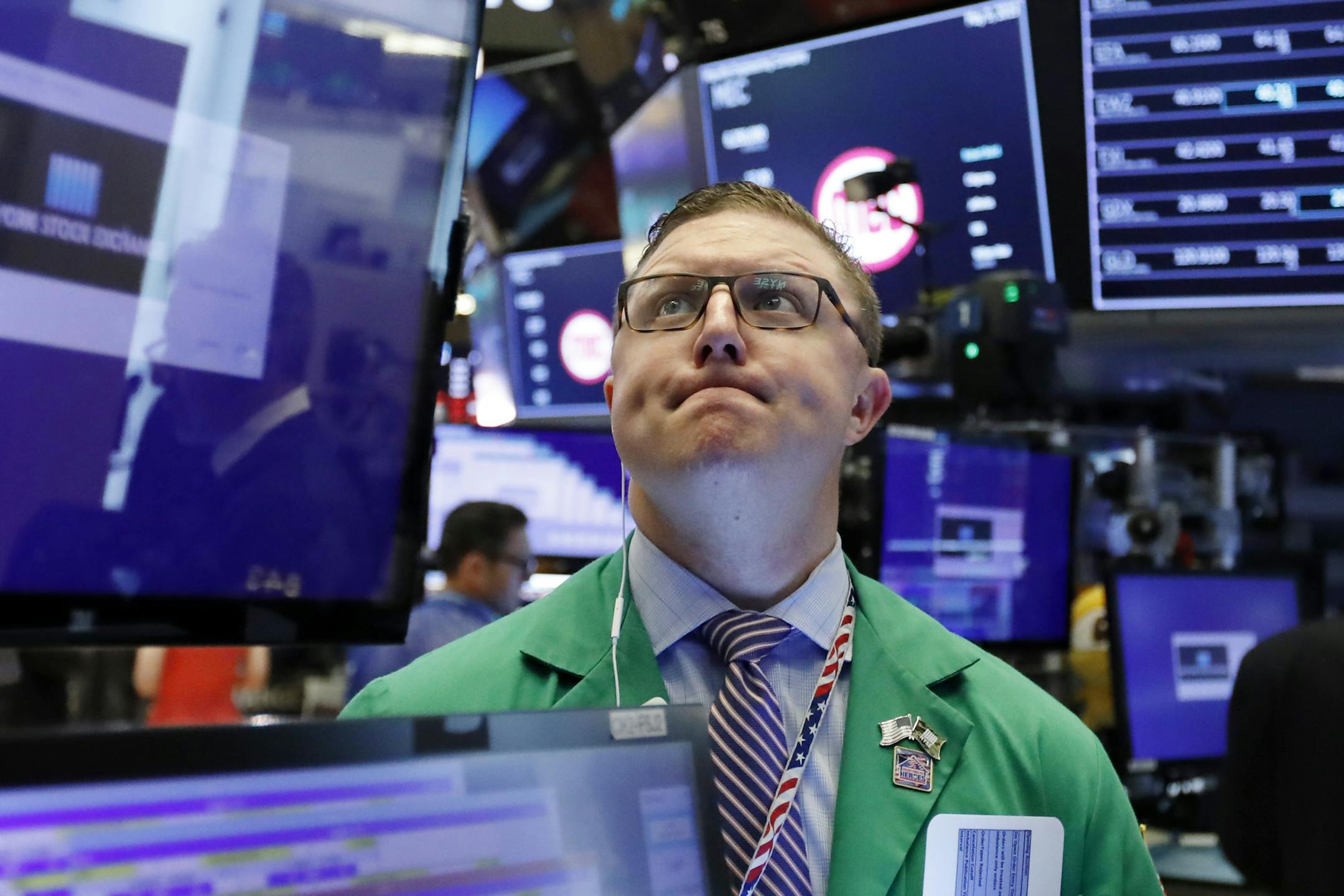 Trader Ryan Falvey works on the floor of the New York Stock Exchange, Thursday, May 9, 2019. Stocks are opening broadly lower on Wall Street as investors keep a close eye on trade talks between the U.S. and China. (AP Photo/Richard Drew)