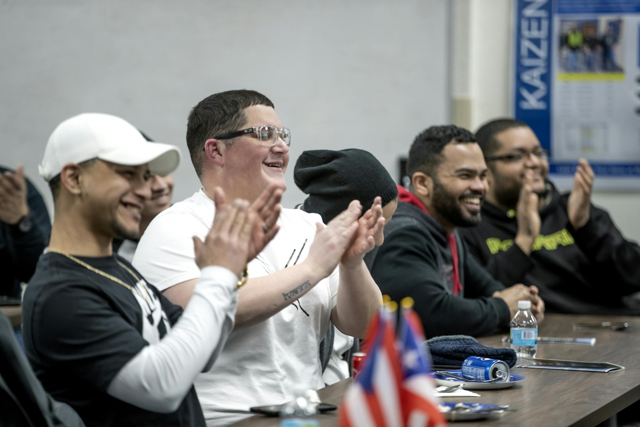 Jose Colon, second from left, clapped as the crew from Puerto Rico were introduced during a community welcome party and open house that Polaris hosted for families from Puerto Rico and the community at the Polaris manufacturing plant, Monday, February 17, 2020 in Roseau, MN.