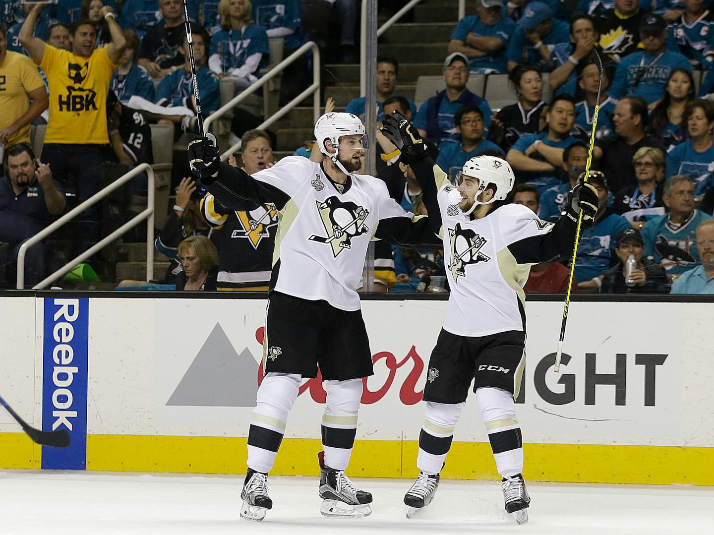 Pittsburgh Penguins defenseman Brian Dumoulin, left, is congratulated by left wing Conor Sheary after scoring during the first period of Game 6 of the NHL hockey Stanley Cup Finals against the San Jose Sharks in San Jose, Calif., Sunday, June 12, 2016. (AP Photo/Marcio Jose Sanchez)