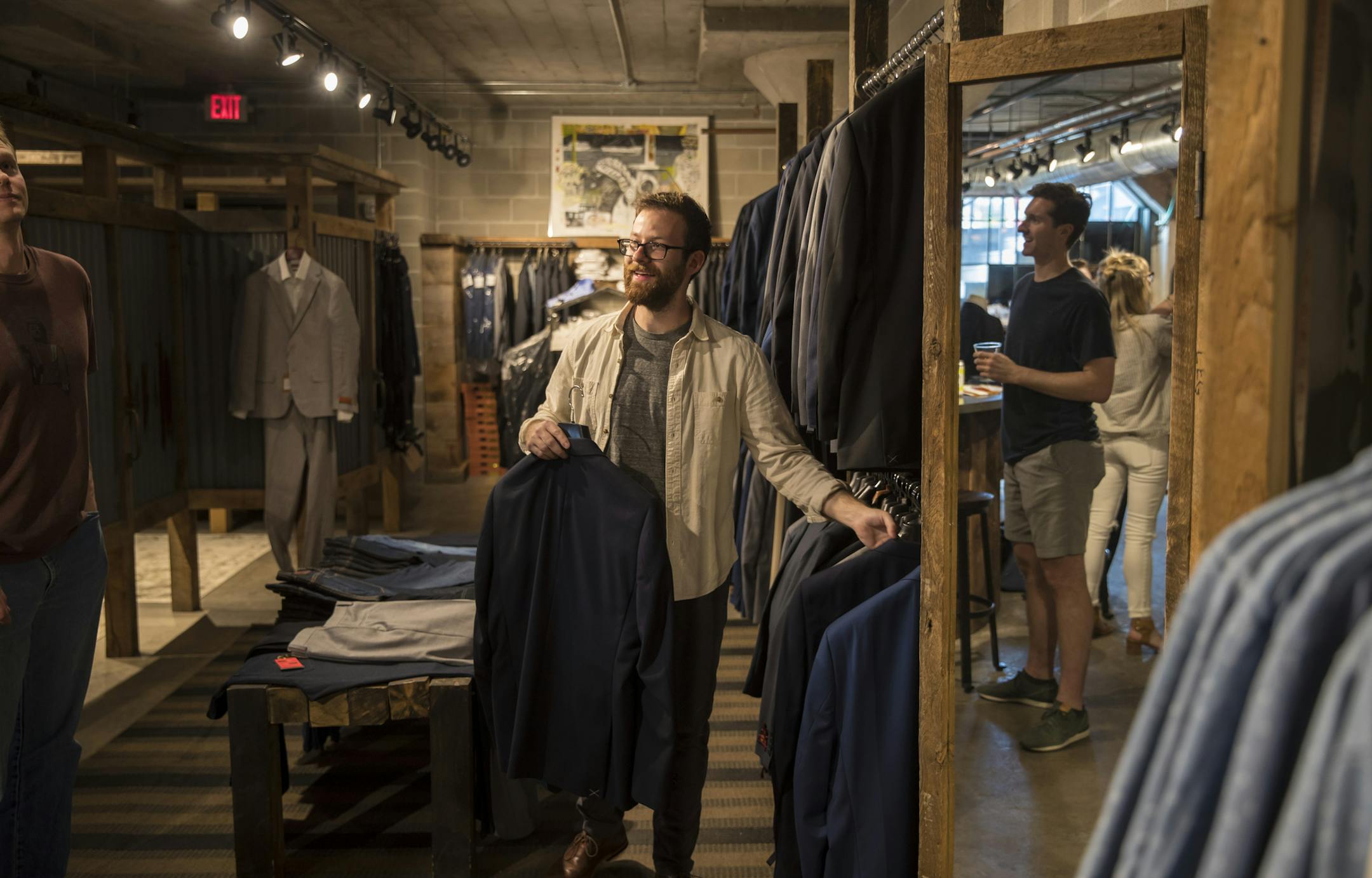 Damon Capetz, co-owner of Minneapolis&#x2019; Atmosfere men&#x2019;s shop, helped Lucas Whelan and his groomsmen choose jackets. &#x201c;Guys are caring more and more about what they wear,&#x201d; Capetz said.