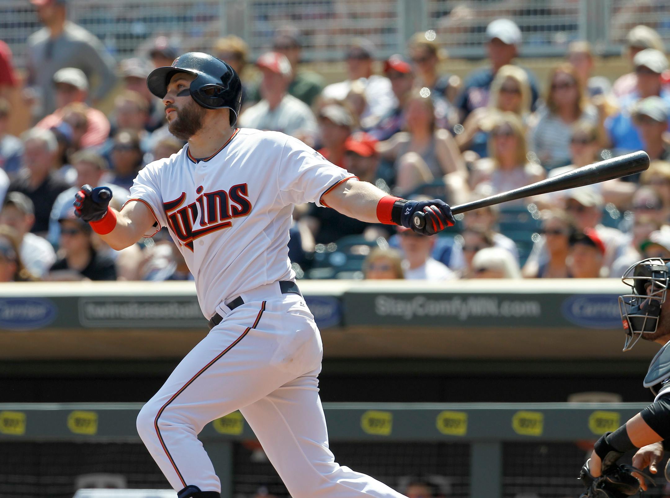 Minnesota Twins' Trevor Plouffe watches the flight of his grand slam off Chicago White Sox starting pitcher John Danks during the third inning a baseball game in Minneapolis, Sunday, May 3, 2015. (AP Photo/Ann Heisenfelt)