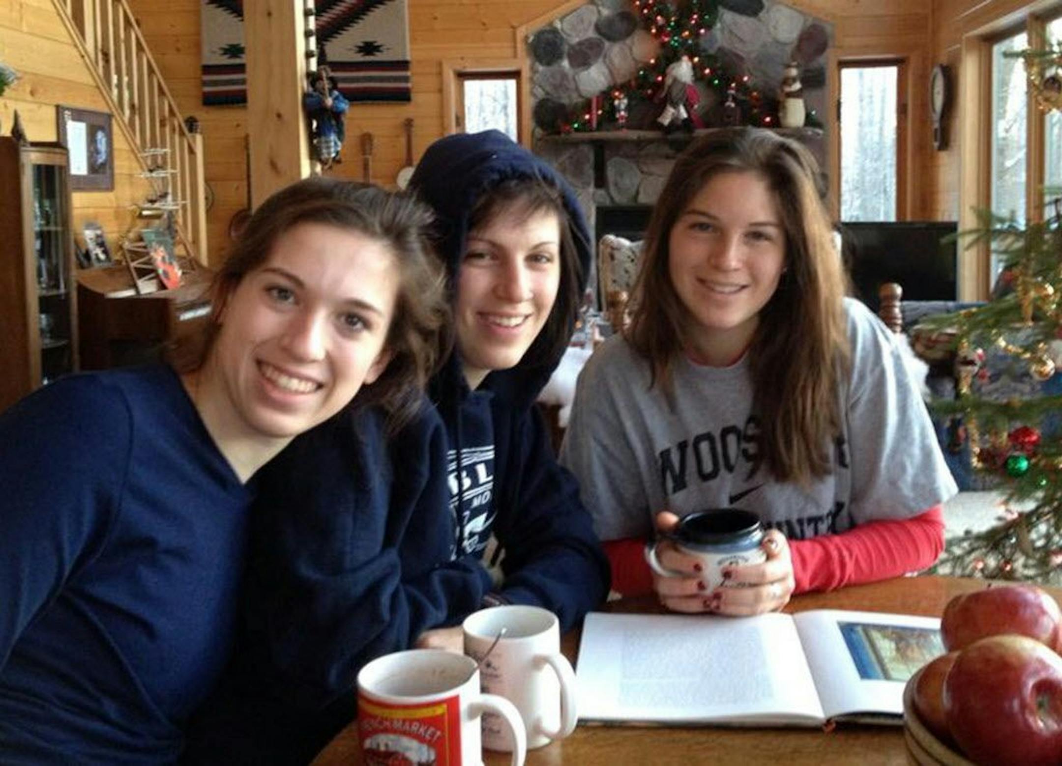 This undated family photo released by the Teton County Sheriff's Office shows Megan Margaret Andrews-Sharer, center, with sisters, Erin, right, and Kelsi. A search is being conducted in a northwest Wyoming wilderness area for the three Wisconsin sisters who failed to return Tuesday, July 7, 2015, from an extended backcountry trip.