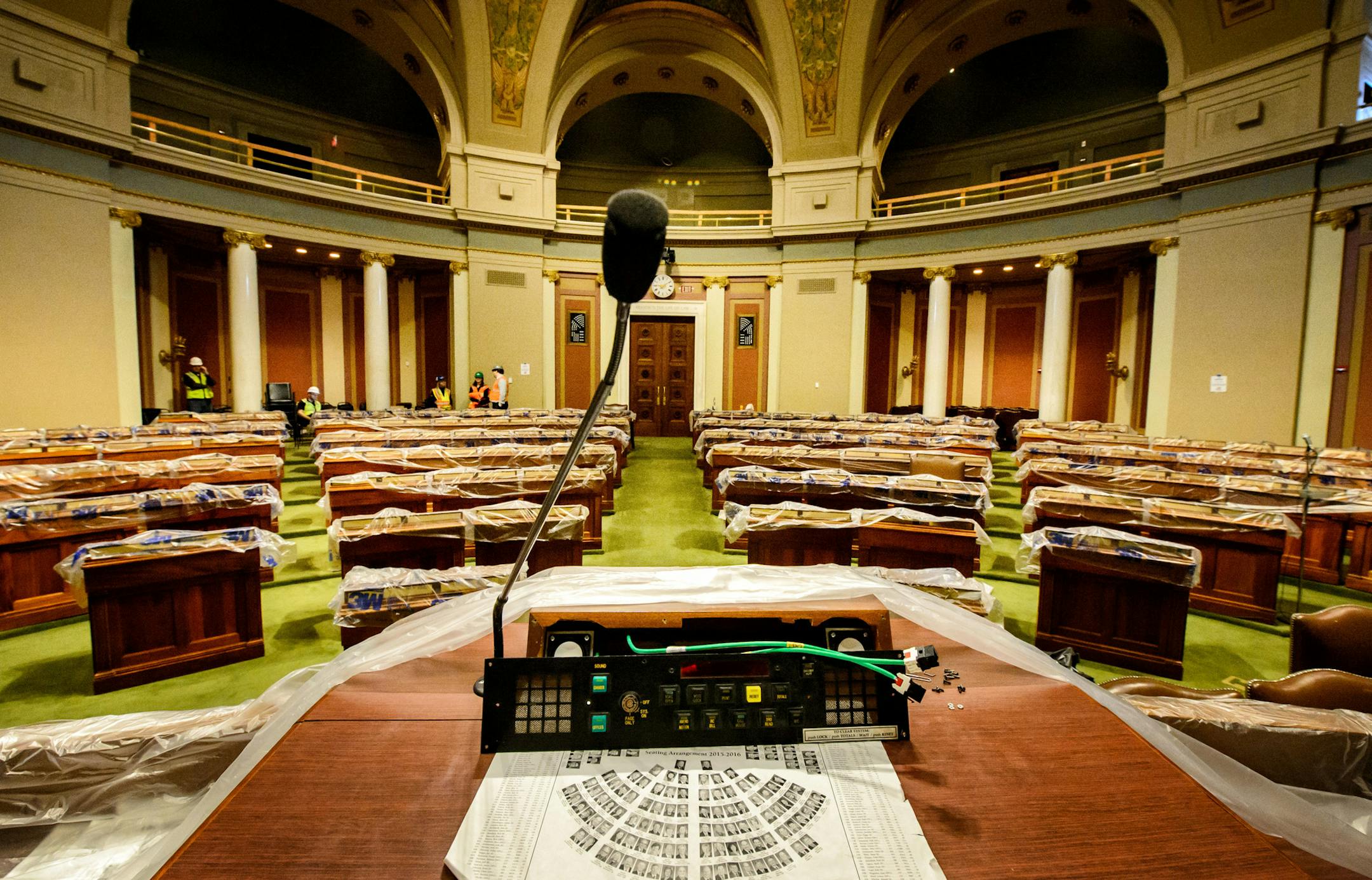 Plastic covered desks in the House Chamber with less than a week before the start of the session. ] GLEN STUBBE * gstubbe@startribune.com Thursday, March 3, 2016 With less than a week left before the beginning of the session, Tour of ongoing renovation work at the Minnesota State Capitol and at the House chamber currently being prepared for the legislative session.