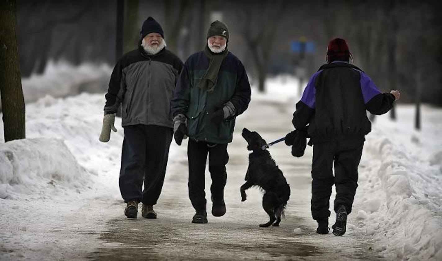 Brothers David, 69. left, and Michael, 66, Gair made their weekly walk around Lake Harriet Sunday as a curious passerby checked them out.