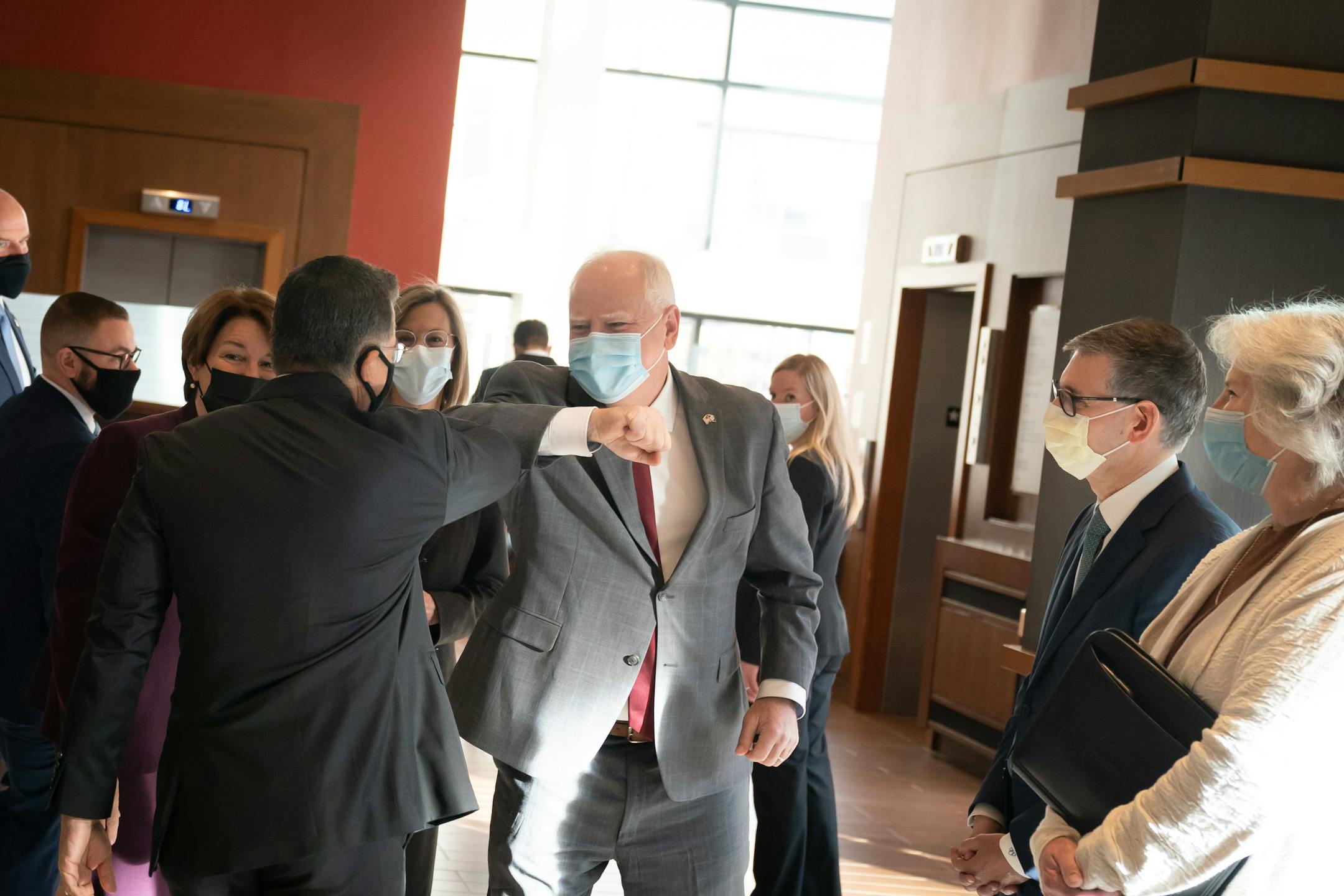 Minnesota Gov. Tim Walz greeted Department of Health and Human Services Sec. Xavier Becerra with an elbow bump before they toured Mayo Clinic, Wednesday, Nov. 10, 2021, in Rochester, Minn. Left to right are U.S. Sen. Amy Klobuchar, Secretary Becerra, Rochester Mayor Kim Norton, Gov Walz, Mayo CEO Gianrico Farrugia, and Minnesota Health Commissioner Jan Malcom. Becerra traveled to Minnesota to encourage pediatric vaccinations and highlight the Biden-Harris Administration's plans to build back better through investments in affordable drug prices. ] GLEN STUBBE • glen.stubbe@startribune.com