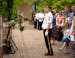 James Schindler, with the Chanhassen American Legion Post 580 honor guard, stood in salute after placing the commemorative wreath tribute at the front