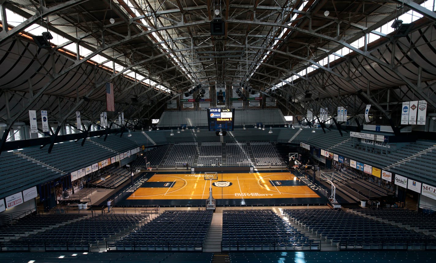 FILE - In this March 30, 2010, file photo, light shines through the windows onto the basketball court at Butler University's Hinkle Fieldhouse in Indianapolis. The NCAA announced Monday, Jan. 4, 2021, that all 67 men's basketball tournament games including the Final Four will be played entirely in Indiana in a bid to keep the marquee event from being called off for a second consecutive year because of the coronavirus pandemic. Games will be played on two courts inside Lucas Oil Stadium as well as at Bankers Life Fieldhouse, Hinkle Fieldhouse, Indiana Farmers Coliseum, Mackey Arena at Purdue and Assembly Hall in Bloomington. Only one game at a time will be played at Lucas Oil Stadium. (AP Photo/AJ Mast, File) ORG XMIT: NY158