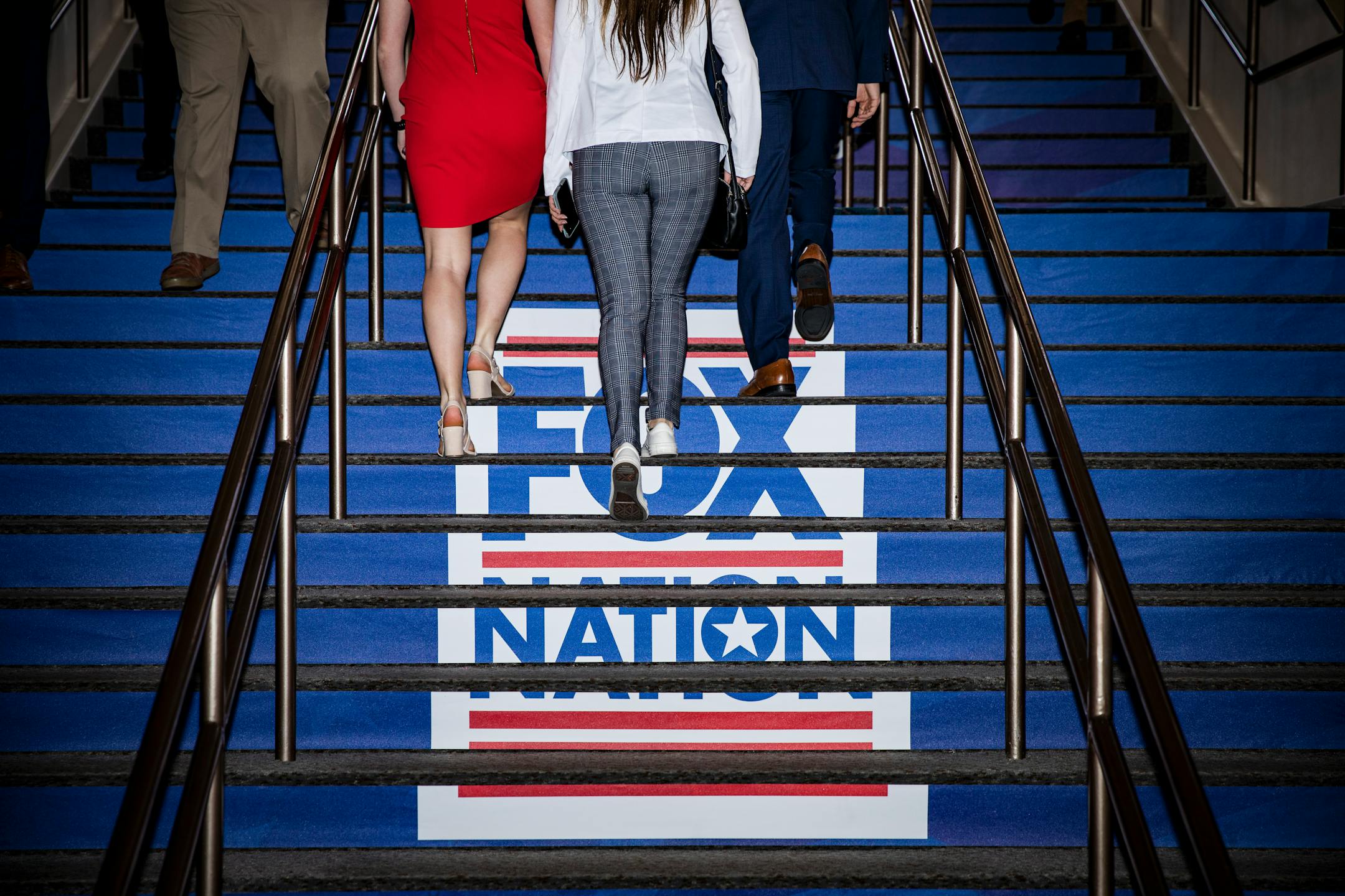 FILE — Fox Nation's advertisements at the CPAC conference held at the Rosen Shingle Creek Hotel in Orlando, Fla., on Feb. 24, 2022. "It is deeply disappointing that Fox News settled the defamation lawsuit brought by Dominion Voting Systems before Rupert Murdoch and his roster of celebrity propagandists had to testify. But it is not surprising. Fox News, after all, had no viable defense," writes New York Times columnist Michelle Goldberg. (Damon Winter/The New York Times)