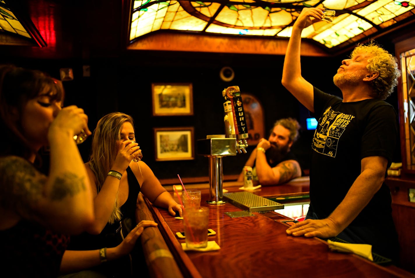 From left, friends Lauren Peper and Alana Tingelhoff, both from Minneapolis, took a drink with Lyall Stearns, a Mortimer's bartender of 23 years, at the bar on the music side of Mortimer's Thursday night. ] AARON LAVINSKY &#xef; aaron.lavinsky@startribune.com How Mortimer&#xed;s went from a forgotten dive bar to the most vital new venue for local punk and indie-rock bands. The rustic old pub, at Lyndale and Franklin, was bought by new owners last year who added a new 150-capacity music room. The