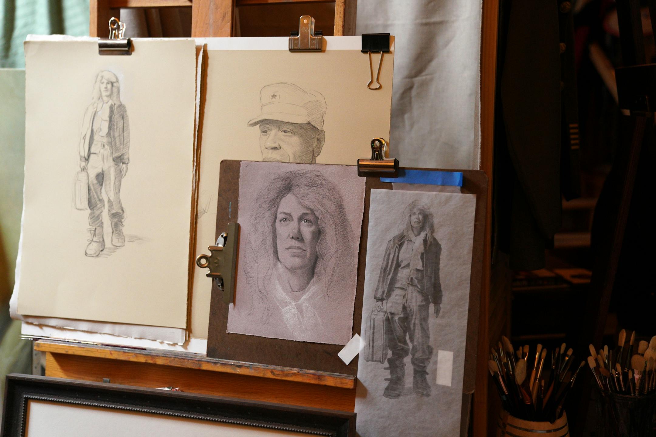 Artist Charles Gilbert Kapsner's wife posed as a model for a figure in the last of five murals for his 10-year U.S. war veterans project at his studio in Little Falls.