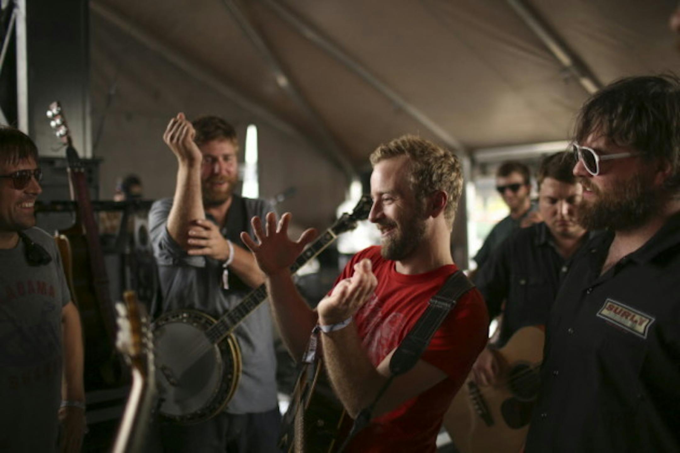 Members of Trampled by Turtles probably telling fishing stories backstage at Kentucky's Forecastle Festival at the peak of their touring mayhem in 2015. / Jeff Wheeler, Star Tribune