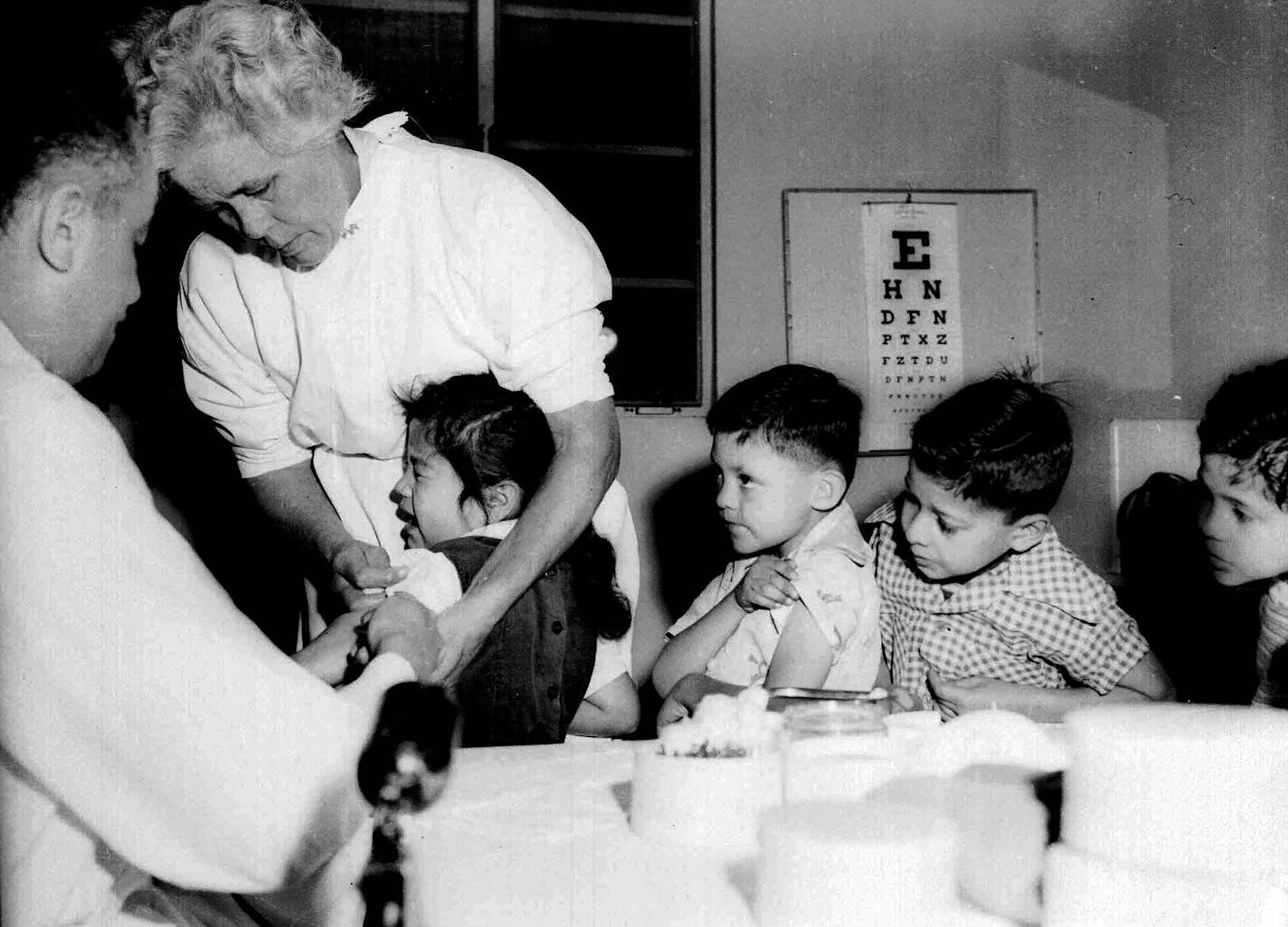 **FILE**First and second graders at St. Vibiana's school are among the first to be innoculated for polio with the new Salk vaccine in Los Angeles, Calif., April 18, 1955. (AP Photo) ORG XMIT: NY335