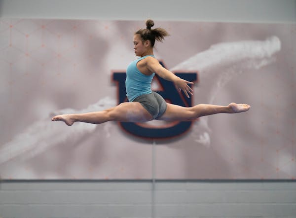 Suni Lee worked out on the balance beam in December during practice at Auburn University.