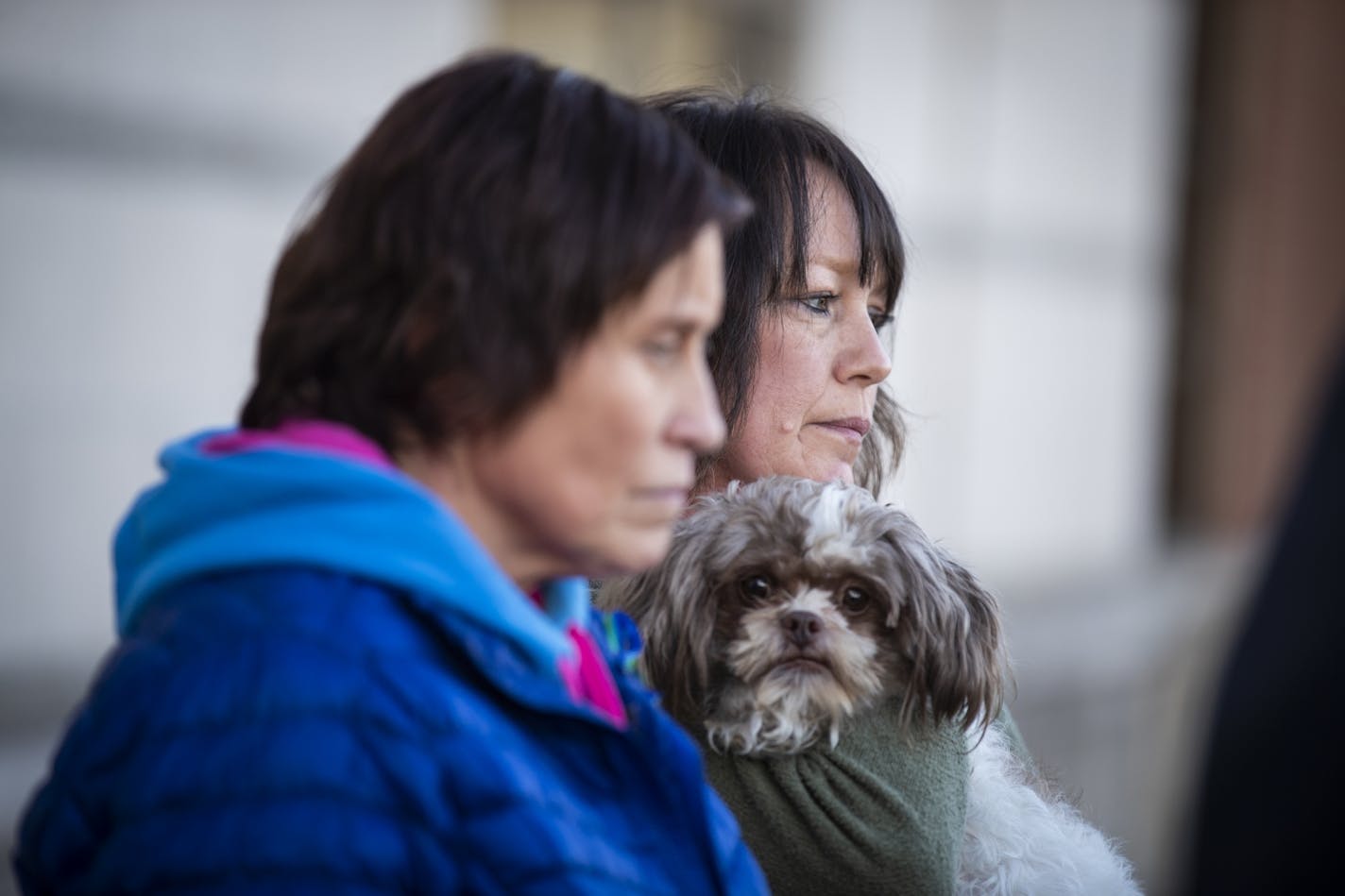 Jennifer Smith, left, and Suzi Allard, aunts of Jayme Closs, stand behind the podium during the press conference. Allard holds Jayme's dog Molly.