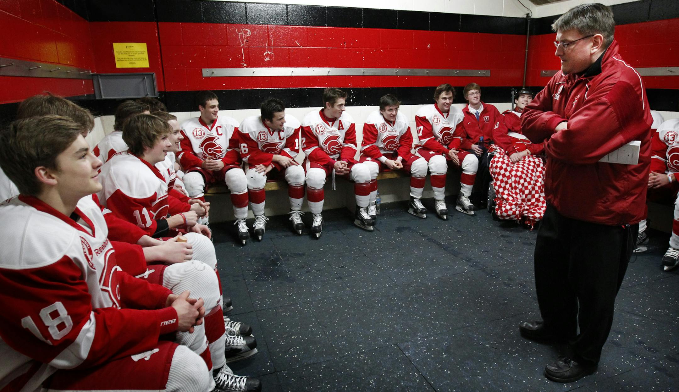 Benilde-St. Margaret's boys' coach Ken Pauly with his players before a section playoff game in 2012, when they won the title. Said Pauly, "Sometimes we talk too much about state and not enough about the sections."