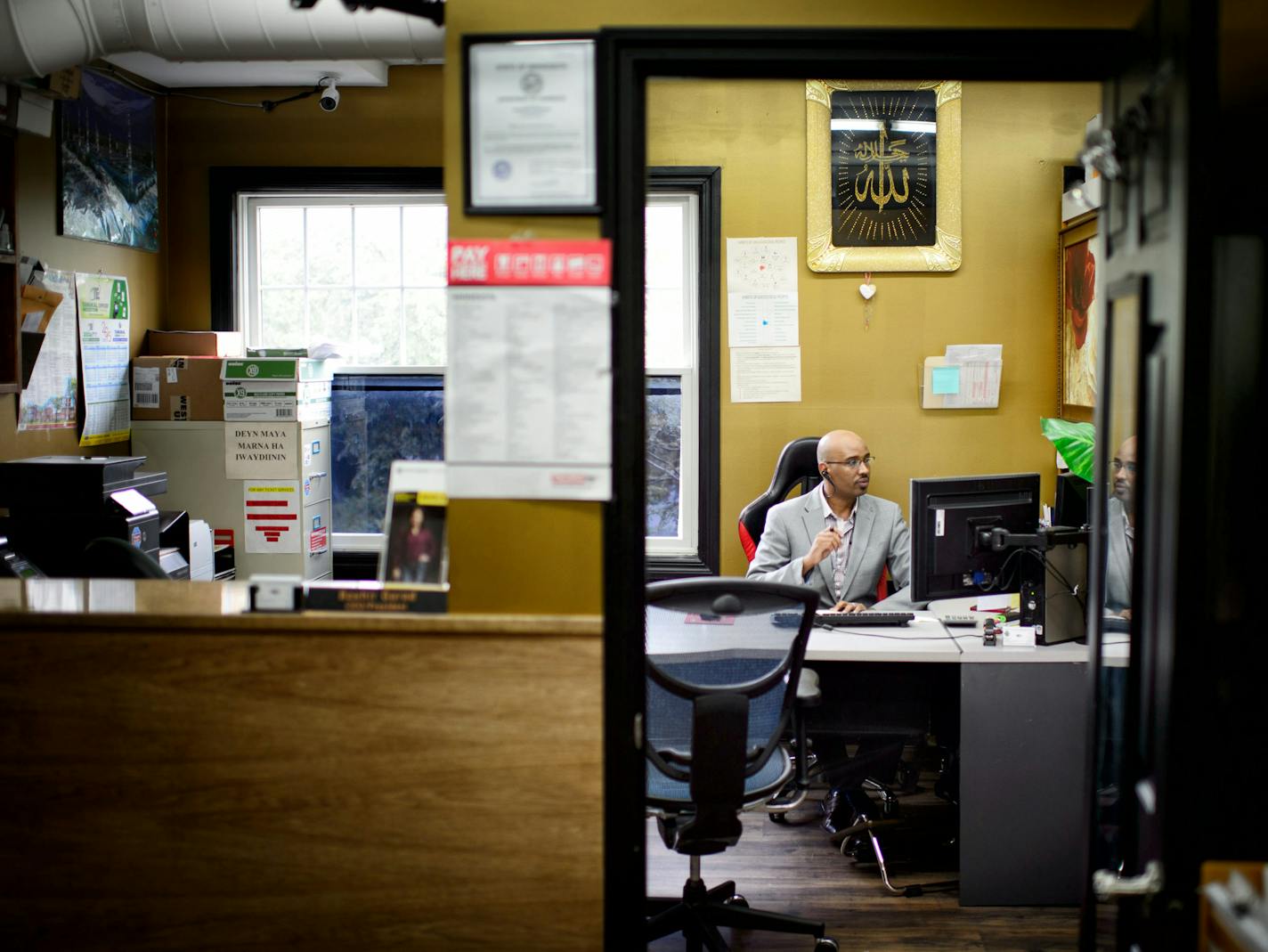 Bashir Garad helped a customer calling from Malawi who was looking to change her flight. ] GLEN STUBBE * gstubbe@startribune.com Thursday September 24, 2015 Bashir Garad, a refugee from Somalia, owns Safari Travel and Accounting Services, a small travel and accounting business out of the Karmel mall in Minneapolis.