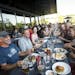 Diners enjoy food and beverages at Surly Brewery in Minneapolis.