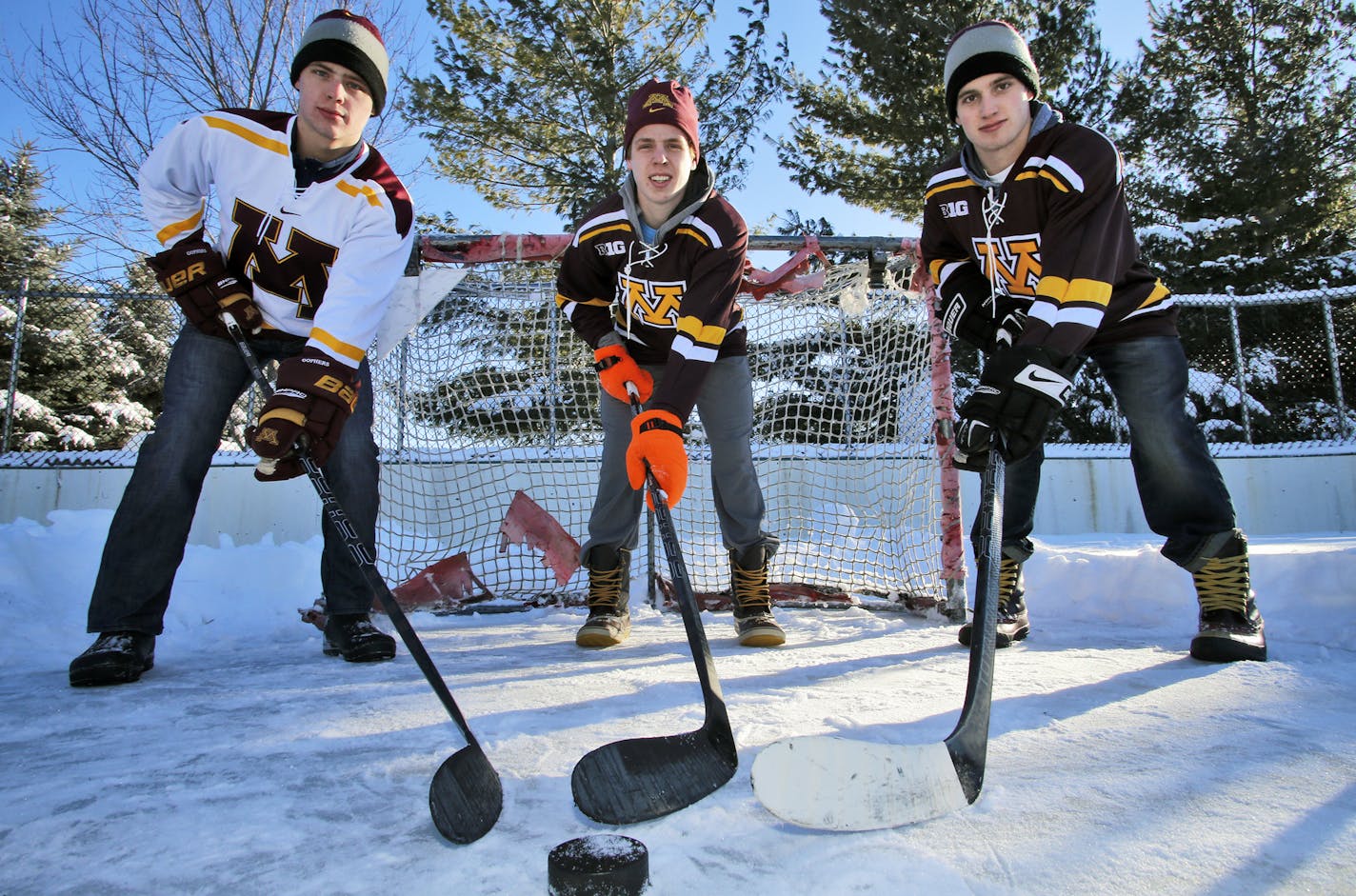 For the first time three brothers play on the UM hockey team - the Reilly brothers from Chanhassen. Connor Reilly, Mike Reilly, Ryan Reilly, l-r, on a hockey rink at their Chanhassen home. (MARLIN LEVISON/STARTRIBUNE(mlevison@startribune.com)