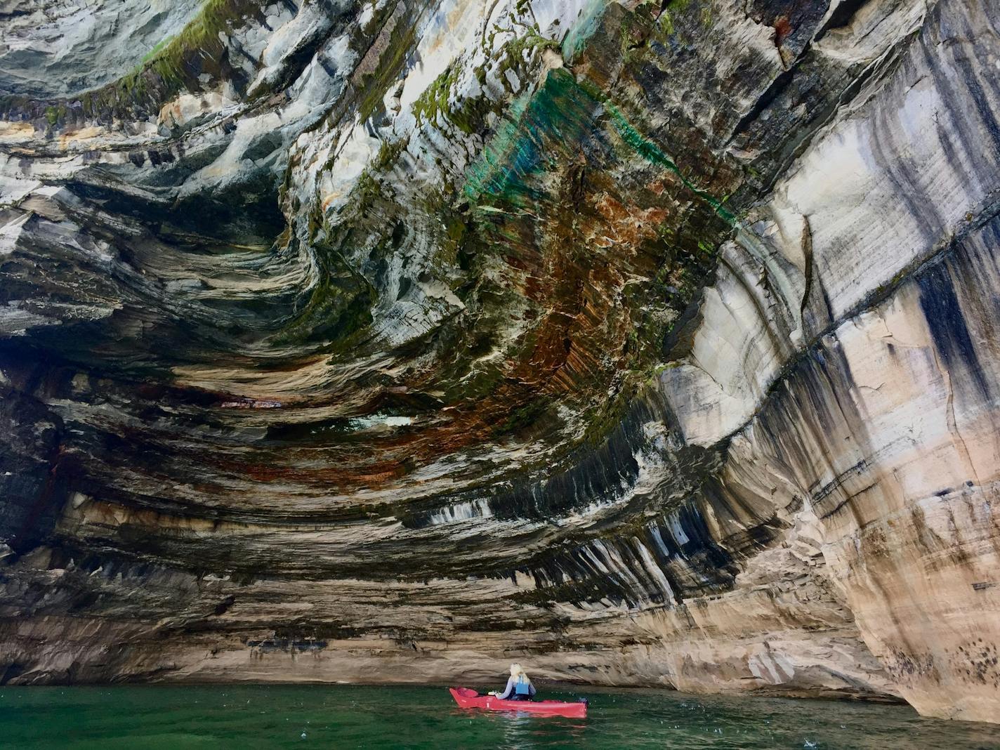 Kayakers paddle along Pictured Rocks National Lakeshore in Michigan, along the south shore of Lake Superior -- one of the highlights along the 1,300-mile Lake Superior Circle Tour.