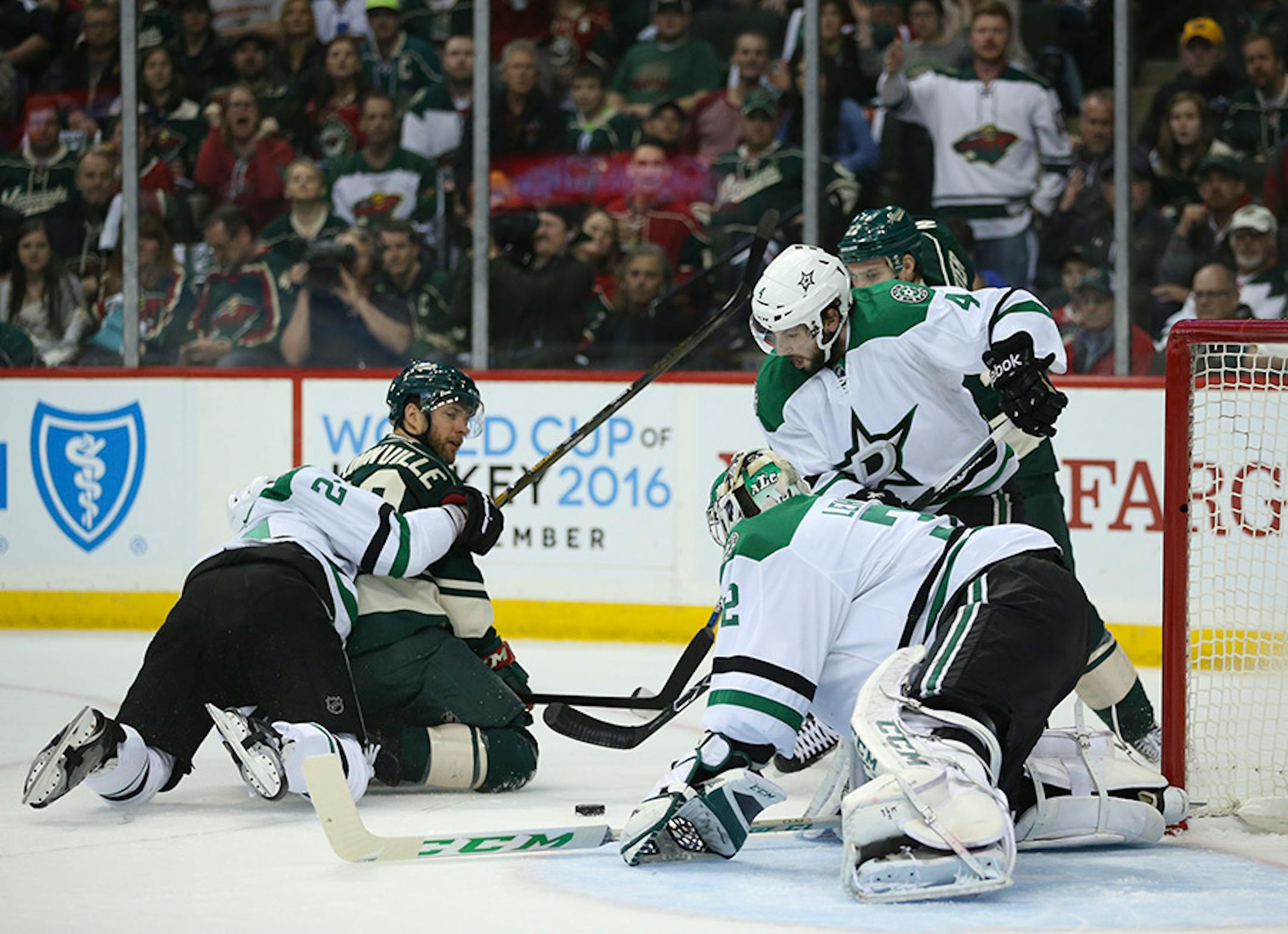 Dallas Stars defenseman Jason Demers (4) tried to clear the puck in front of goalie Kari Lehtonen in the first period Monday night.