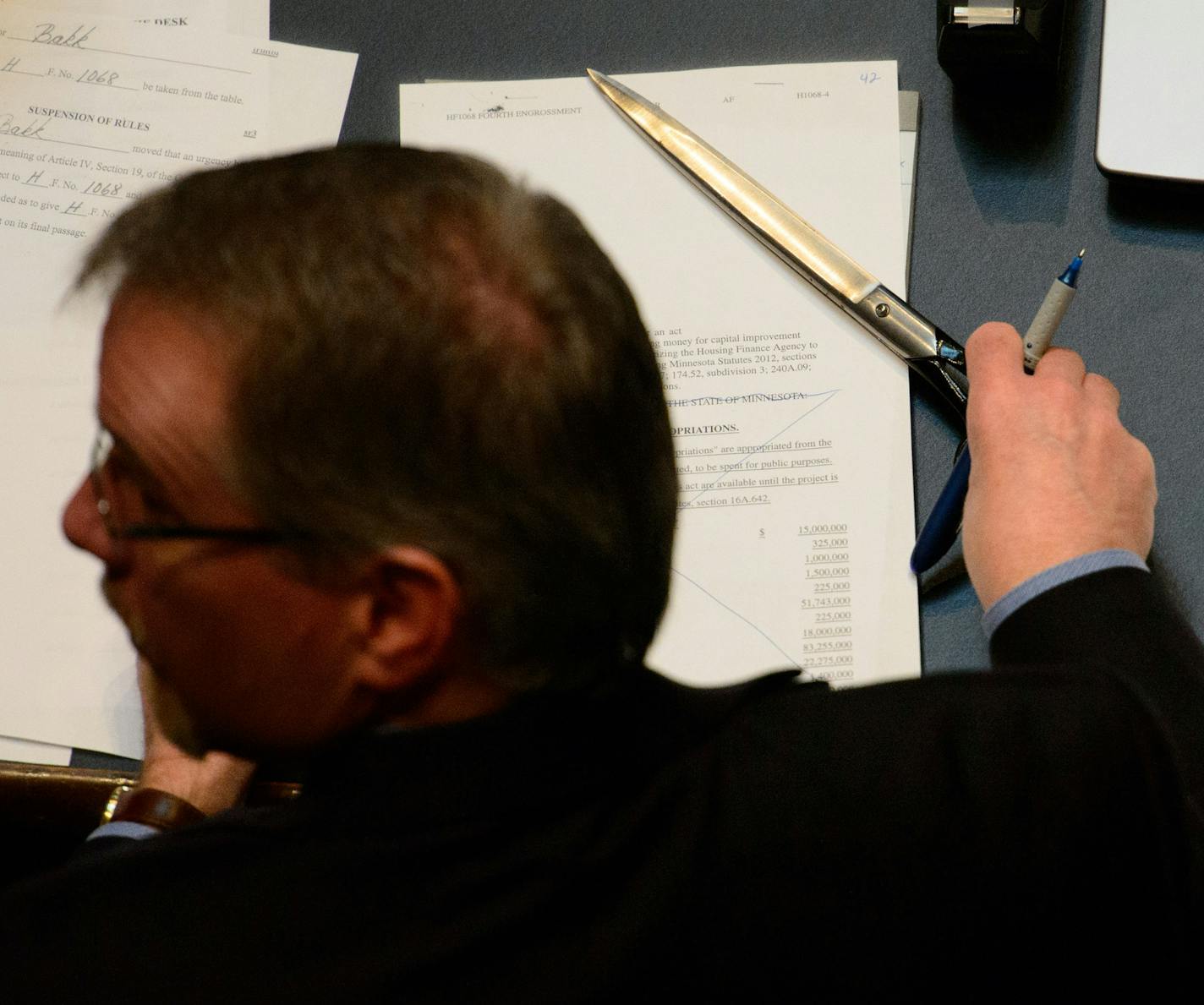 Mike Linn Second Assistant Secretary of the Senate wields a huge scissor as he handles the flow of bills and amendments. ] Friday, May 16, 2014 GLEN STUBBE * gstubbe@startribune.com