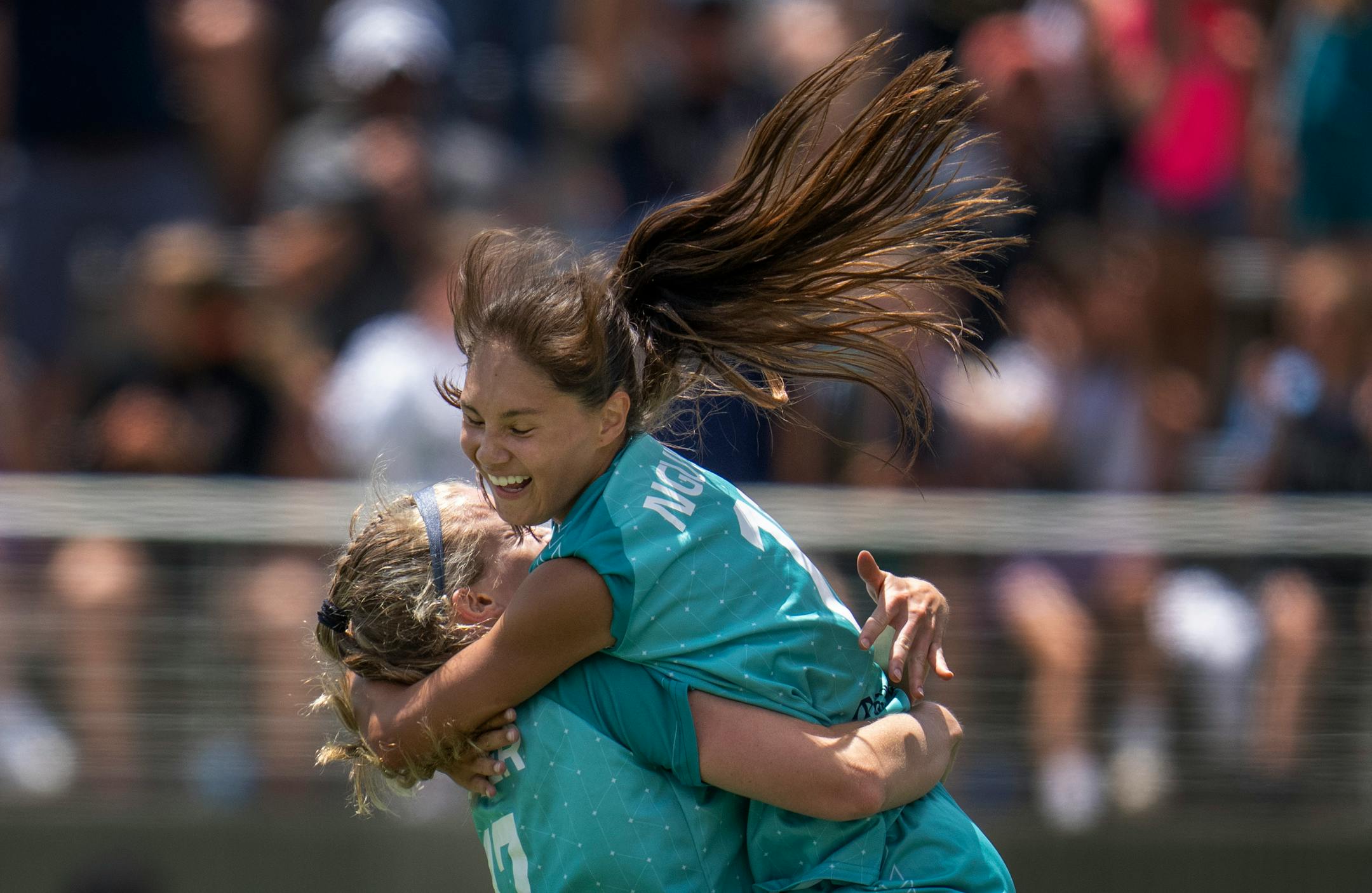 Mariah Nguyen, right, celebrates her first half goal with Morgan Turner.