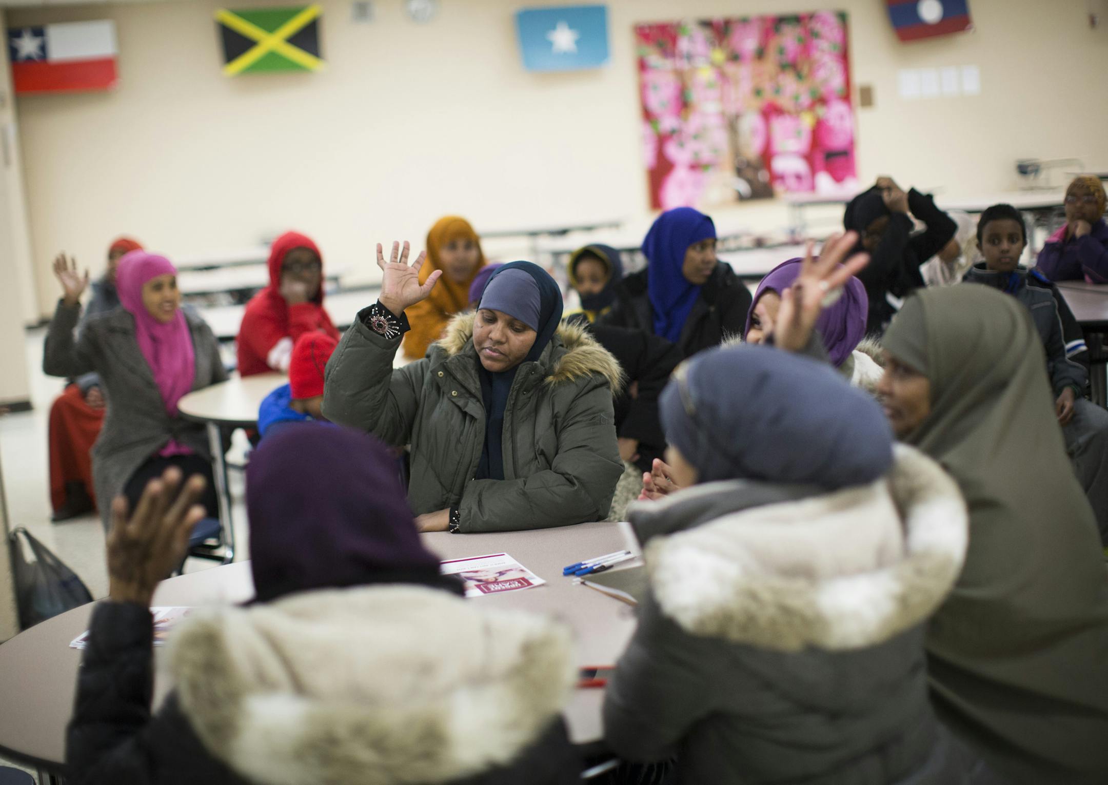 Farhya Jama raised her hands indicating she was interested in applying for another grant tailored to Somali-American women who want to exercise in public settings such as a gym or a pool, during a graduation party at the end of previous program at in Shakopee, Minn., on January 21, 2016. ] RENEE JONES SCHNEIDER &#xef; reneejones@startribune.com