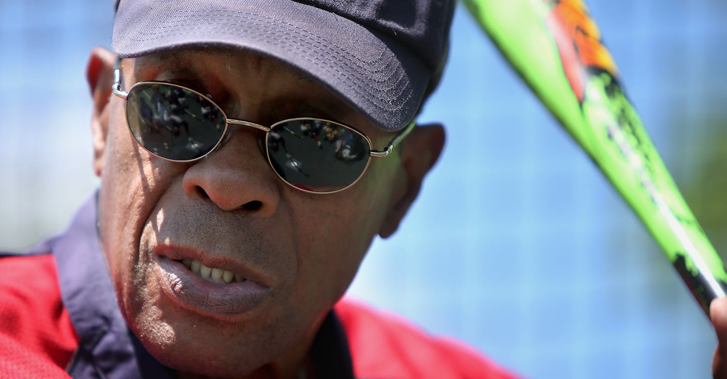 Hall of Famer Rod Carew gave batting lessons to young boys during a baseball camp at the Minnetonka High School baseball field, Wednesday, July 2, 2014 in Minnetonka, MN. ] (ELIZABETH FLORES/STAR TRIBUNE) ELIZABETH FLORES &#x2022; eflores@startribune.com ORG XMIT: MIN1407021513100002