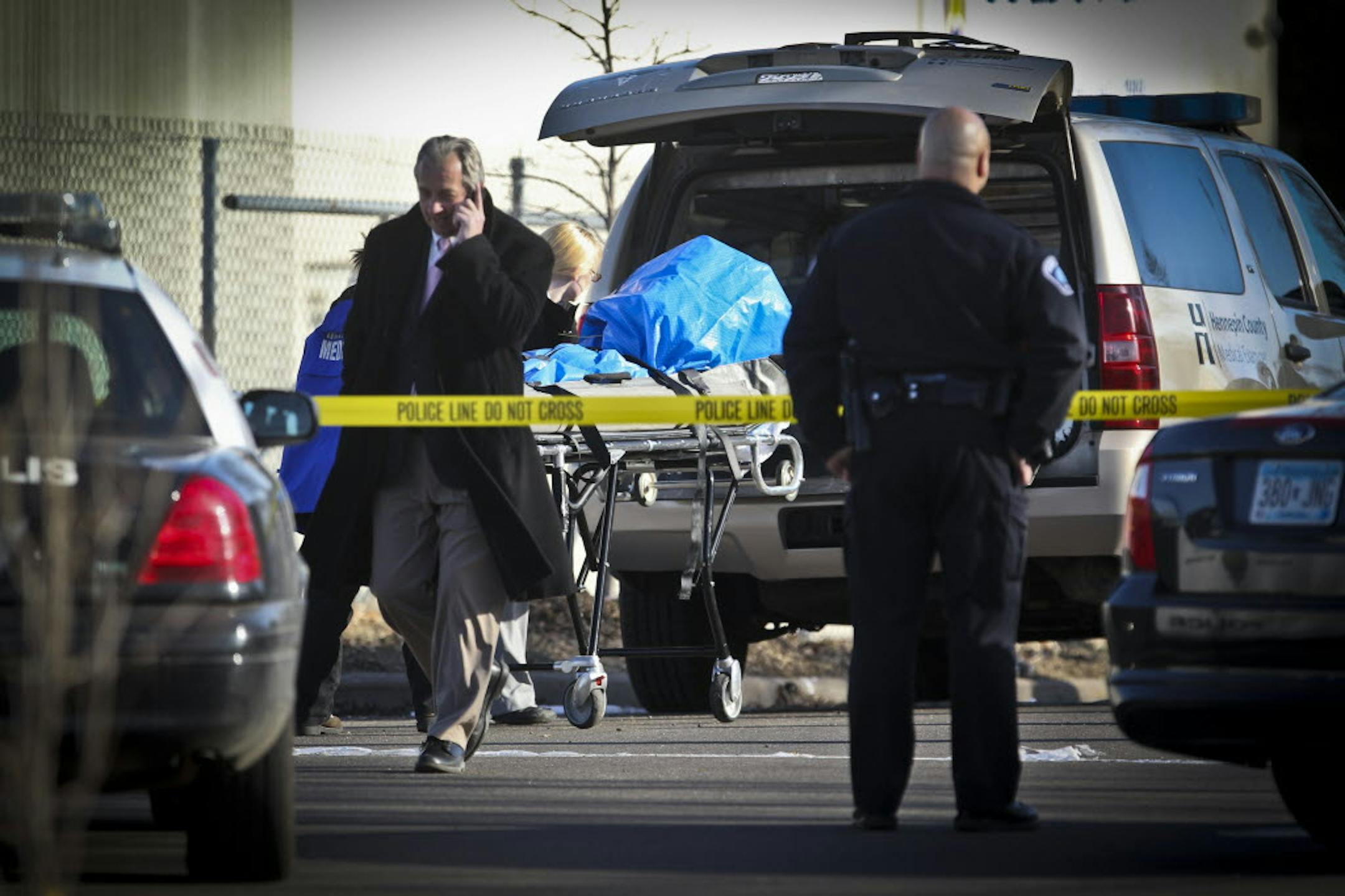 Medical examiners removed the body of an adult male who was killed in a shooting on Humboldt Avenue North in Minneapolis on Tuesday.