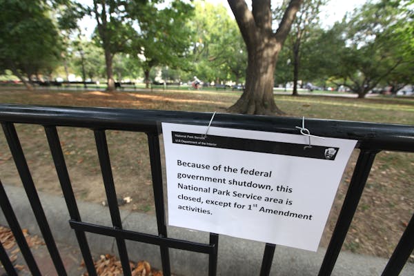 A closed sign hangs on a fence at Lafayette Park in Washington D.C., U.S., on Thursday, Oct. 3, 2013. The first face-to-face talks between President B
