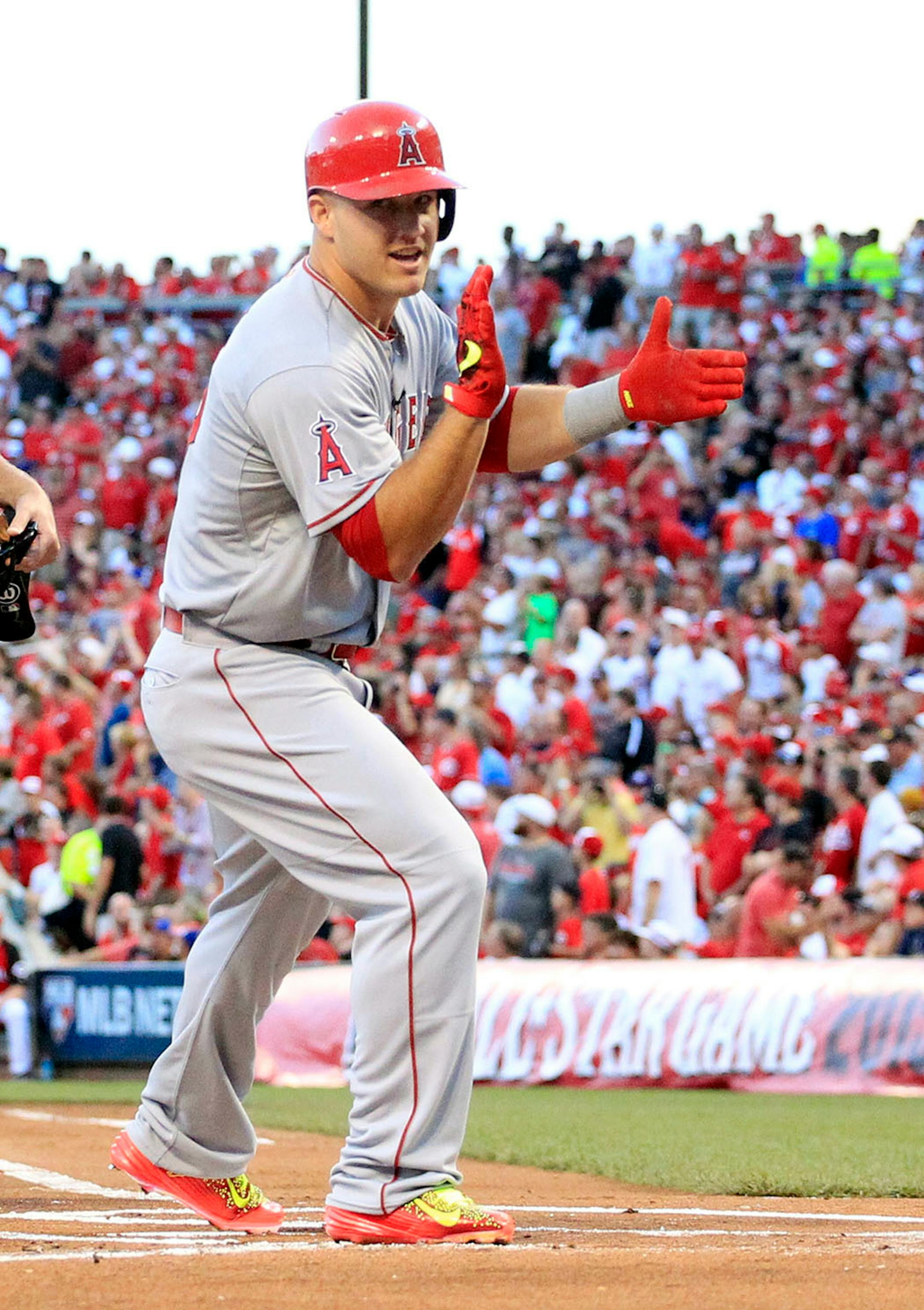 American League's Mike Trout, of the Los Angeles Angels, reacts after hitting a home run during the first inning of the MLB All-Star baseball game, Tuesday, July 14, 2015, in Cincinnati.