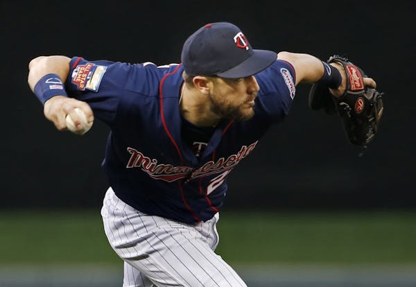 Minnesota Twins third baseman Trevor Plouffe throws out the New York Yankees' Brendan Ryan in the fifth inning at Target Field in Minneapolis on Thurs