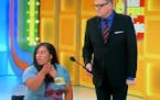 Drew Carey on "The Price Is Right" with Danielle, a contestant in a wheelchair who ultimately won a treadmill.