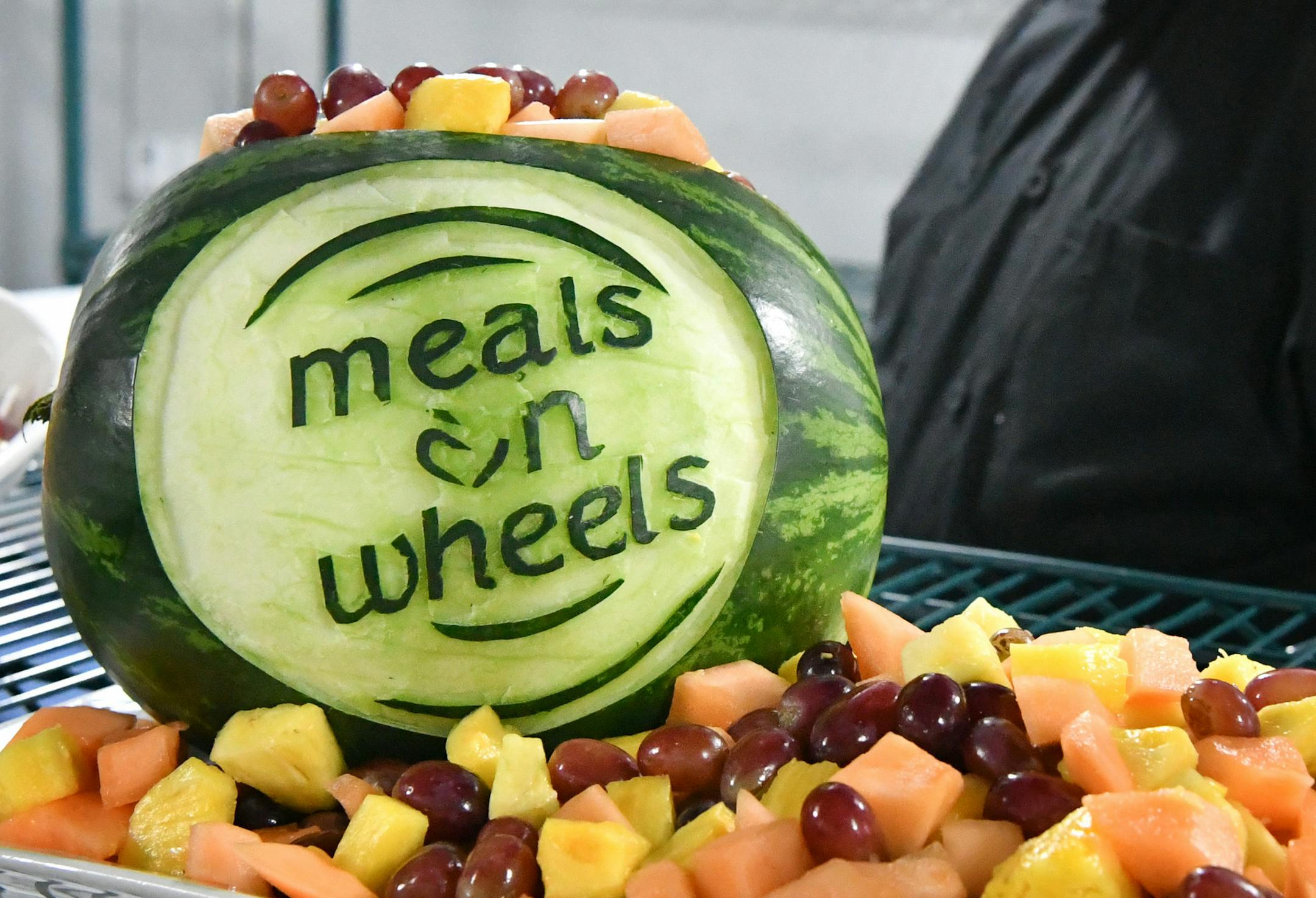 Executive Chef Kris Almsted carved this Meals on Wheels watermellon fresh fruit platter for the grand opening celebration. ] GLEN STUBBE • glen.stubbe@startribune.com Wednesday May 3, 2017 Meals on Wheels is opening its first kitchen specifically dedicated to serving Meals on Wheels recipients in the Twin Cities. The organization says it's a big deal, especially amid current uncertainties around federal funding.