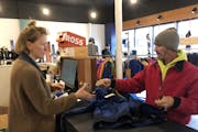 Great Lakes Gear Exchange co-owner Brooke Wetmore rang up a ski jacket for Joe Schiavone. "I couldn't pass it up. It's a great deal," he said.