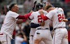 The Braves' Austin Riley (27) celebrates his walk-off RBI single in the 10th inning against the Guardians on Sunday.