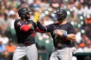 The Twins' Carlos Santana (30) and Kyle Farmer have struggled at the plate along with most of their teammates. Santana singled Sunday, ending an 0-for