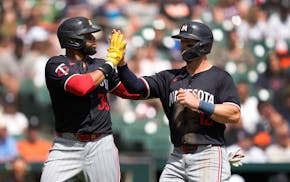 The Twins' Carlos Santana (30) and Kyle Farmer have struggled at the plate along with most of their teammates. Santana singled Sunday, ending an 0-for