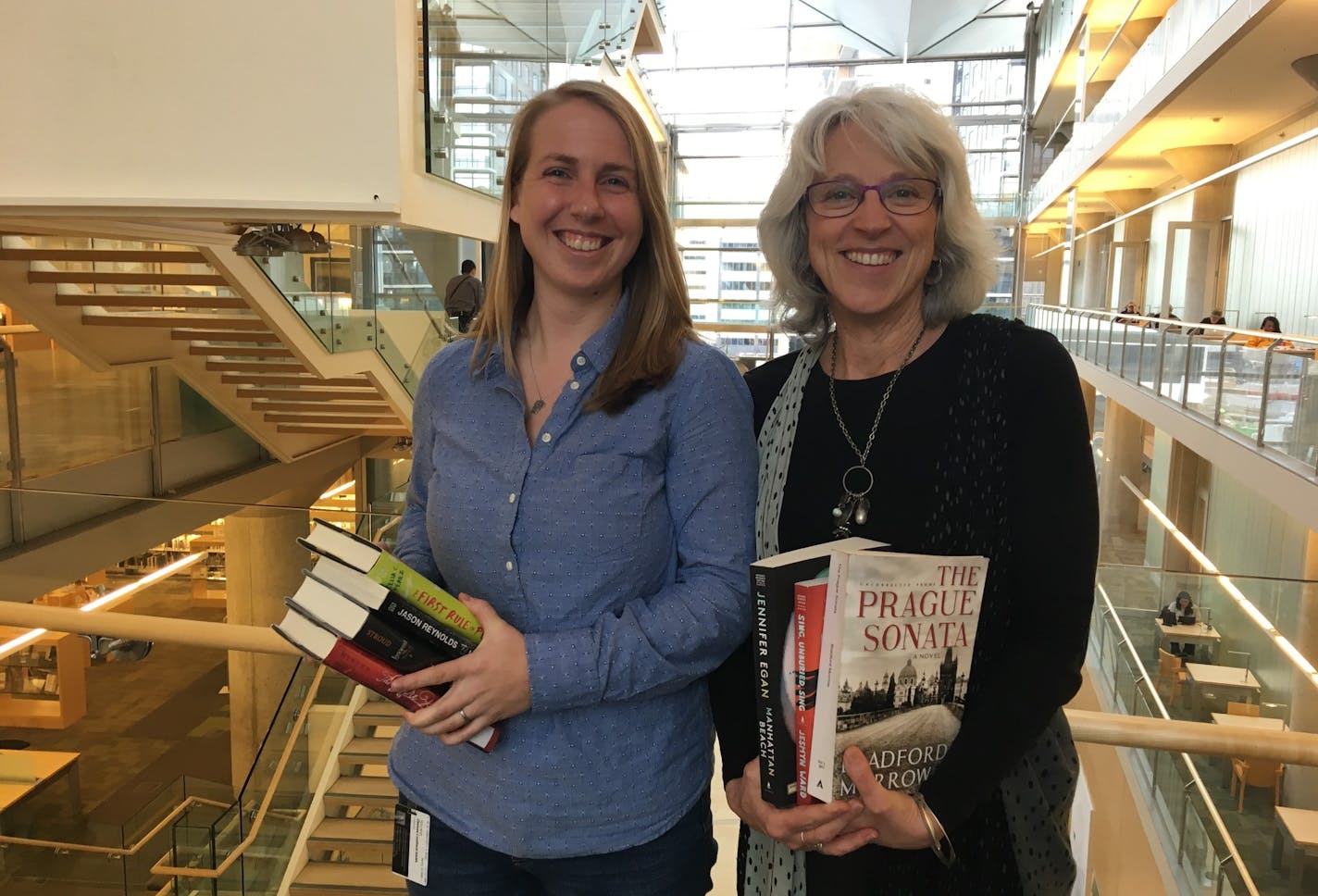 Chelsea Couillard-Smith, left, and Susan Carr are two of the librarians who decide which of the thousands of books the Hennepin County Library will buy each year.