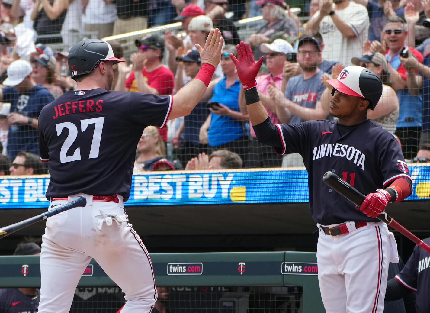 Twins catcher Ryan Jeffers is met at home plate by second baseman Jorge Polanco after a two-run double hit by Carlos Correa in the seventh inning Thursday at Target Field.