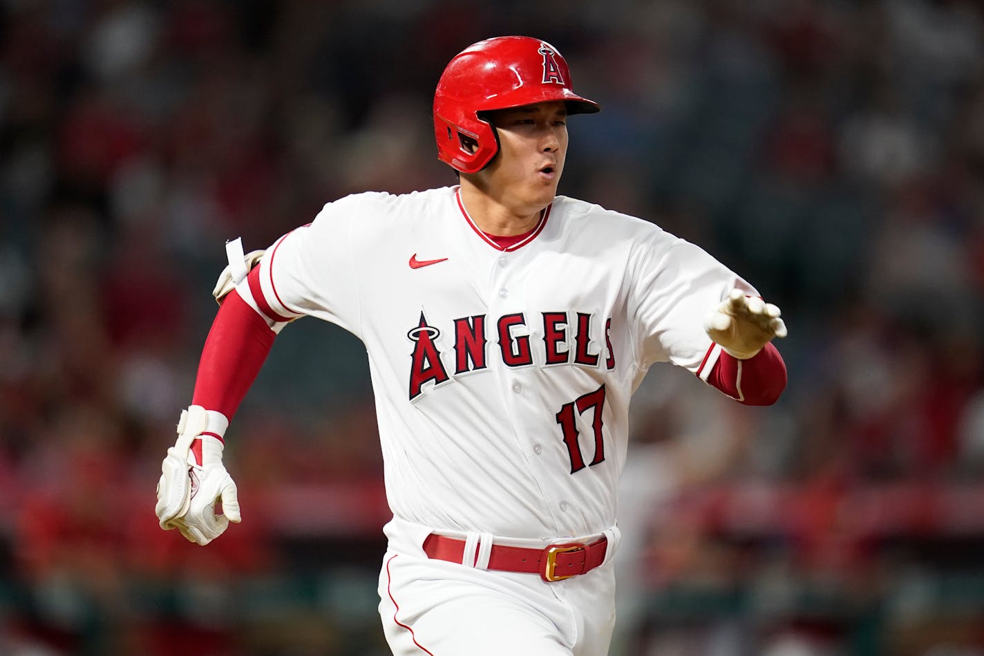 Los Angeles Angels designated hitter Shohei Ohtani (17) runs to first while grounding out during the eighth inning of a baseball game against the Minnesota Twins in Anaheim, Calif., Friday, Aug. 12, 2022. (AP Photo/Ashley Landis)