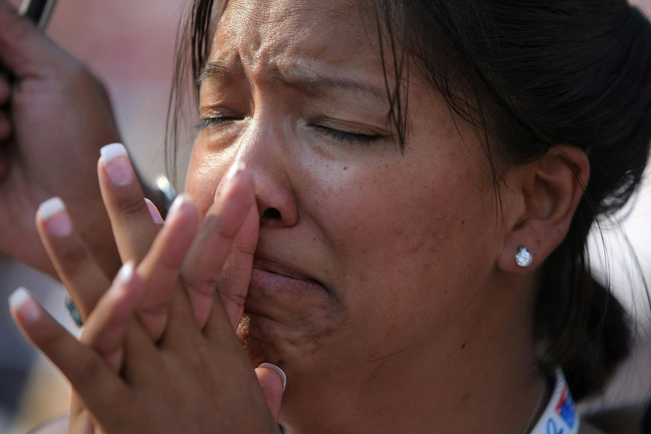 DENVER - AUGUST 28: Kristine Reeves of Washington State cries during a speech by Martin Luther King, III on day four of the Democratic National Convention (DNC) at Invesco Field at Mile High August 28, 2008 in Denver, Colorado. U.S. Sen. Barack Obama (D-IL) is the first African-American to be officially nominated as a candidate for U.S. president by a major party.