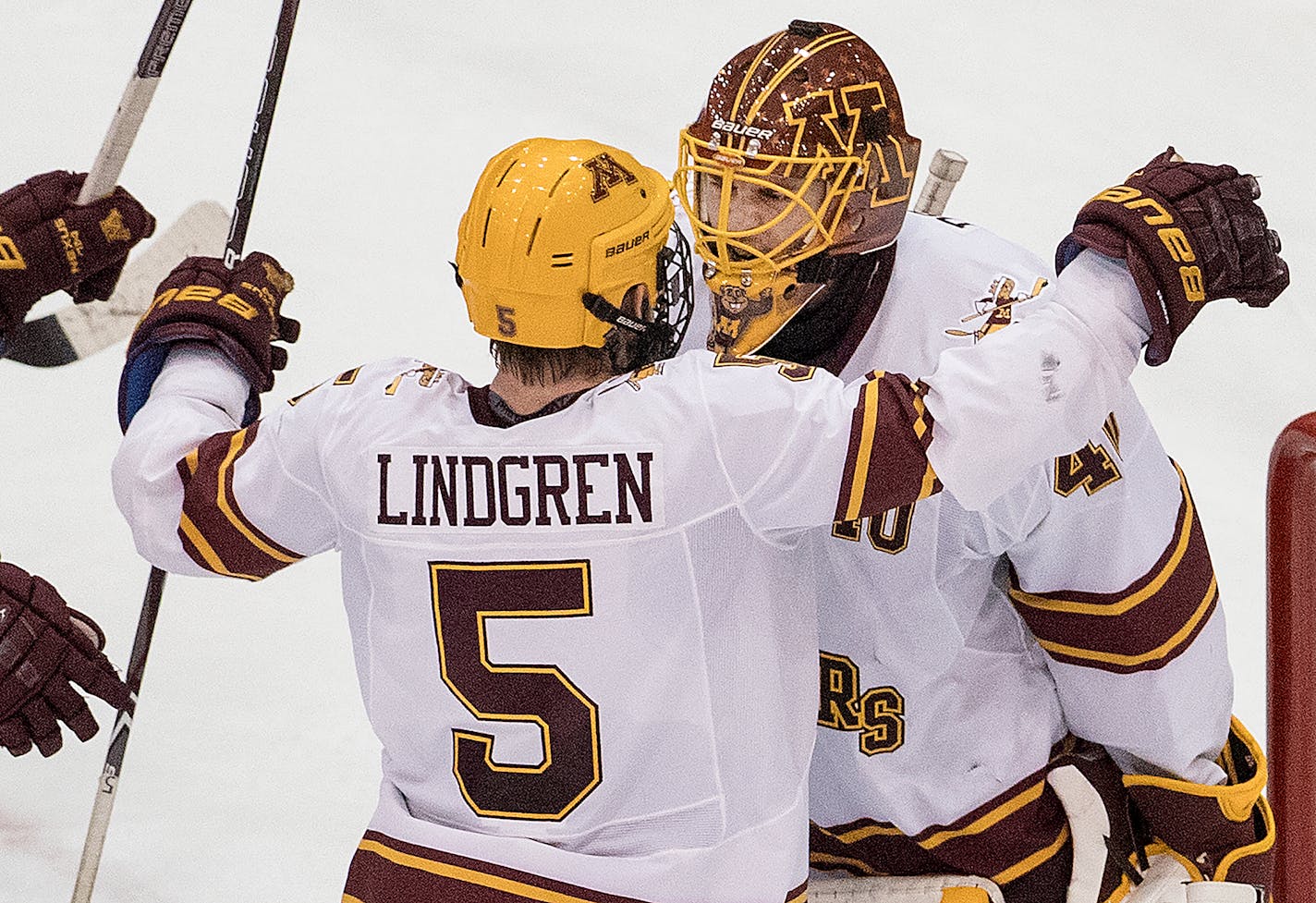 Ryan Lindgren (5) celebrated with Gophers goalie Mat Robson (40) at the end of the game. Robson had 34 saves in the 2-0 victory over St. Cloud State. ] CARLOS GONZALEZ � cgonzalez@startribune.com - January 7, 2018, Minneapolis, MN, Mariucci Arena, NCAA Hockey, University of Minnesota Gophers vs. St. Cloud State Huskies