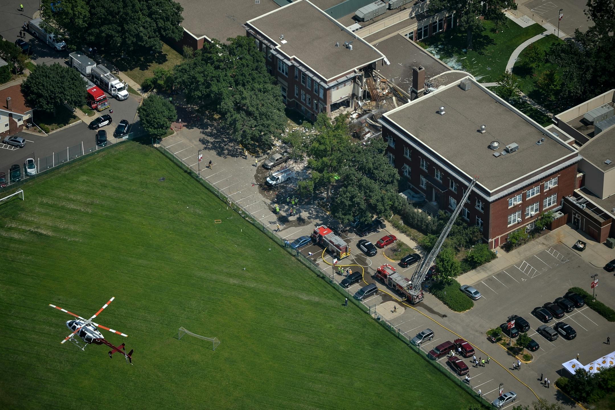 A Minnesota State Trooper helicopter flew over Minnehaha Academy as firefighters worked on their rescue operation following Wednesday morning's explosion.