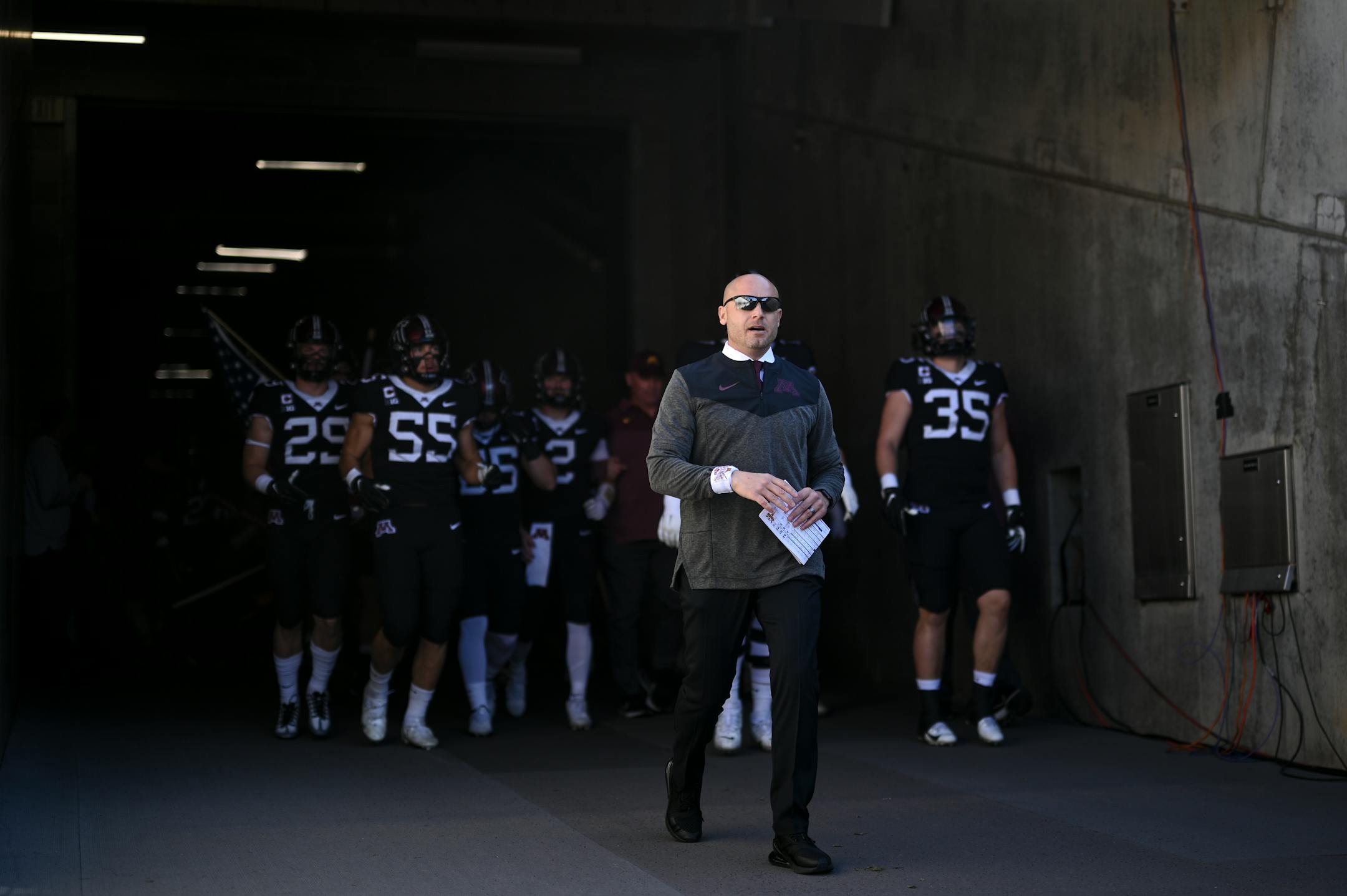 Minnesota Golden Gophers head coach P.J. Fleck leads the team onto the field before the start of their game.