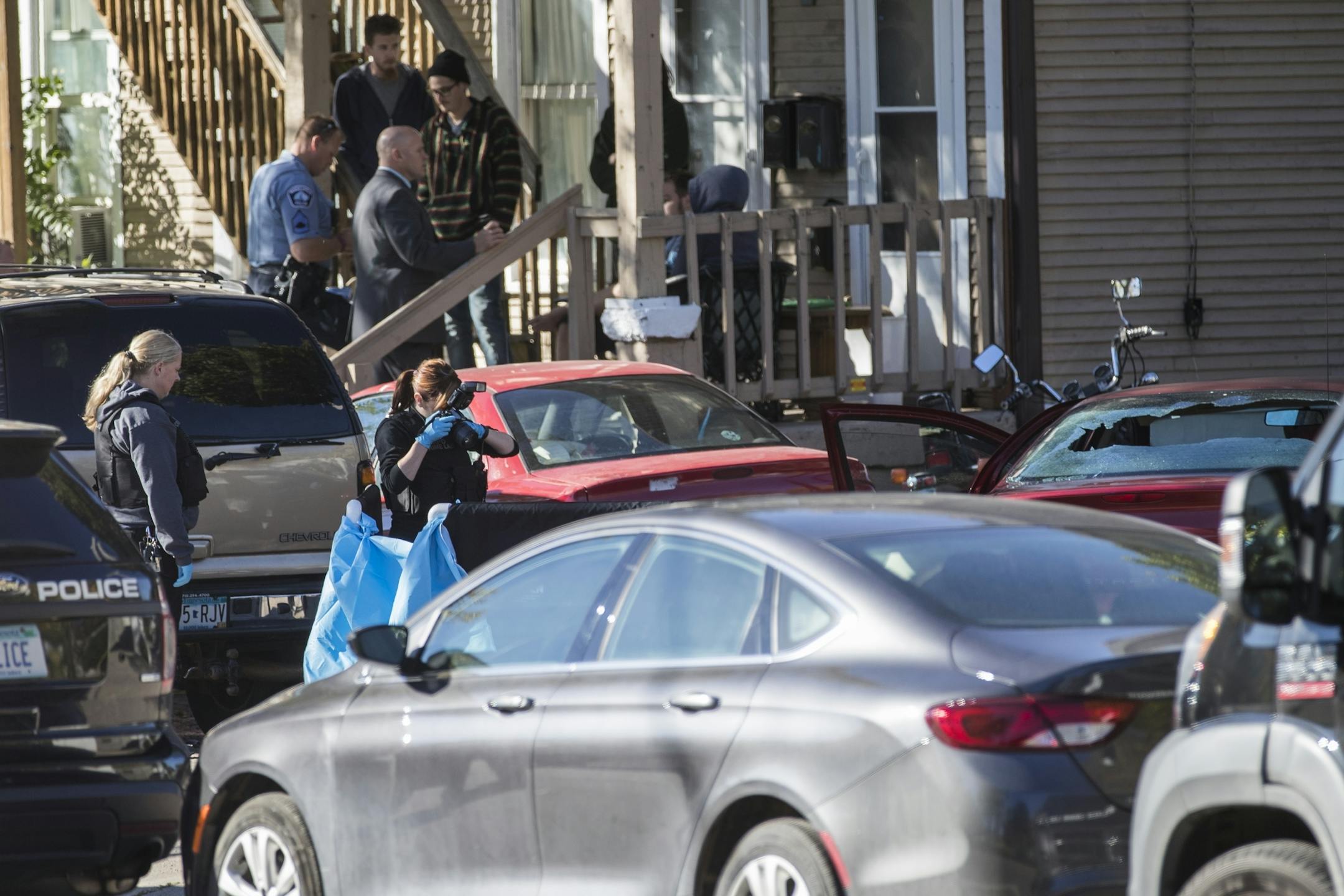 Investigators work the scene of the shooting.